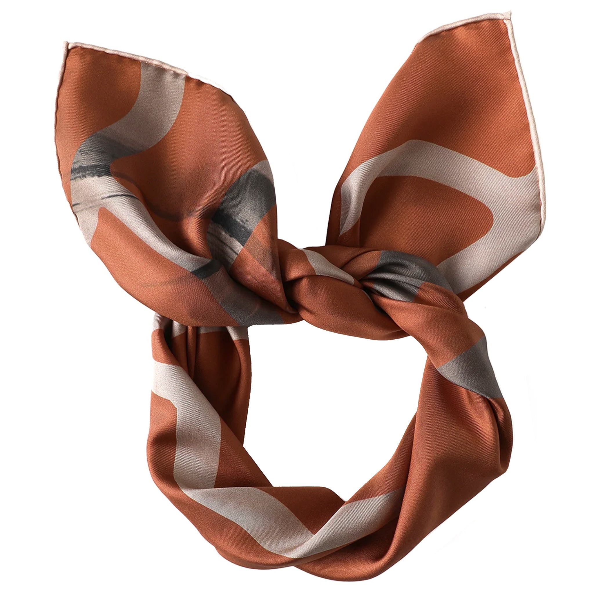 Brown and beige patterned scarf tied into a bow on a white background