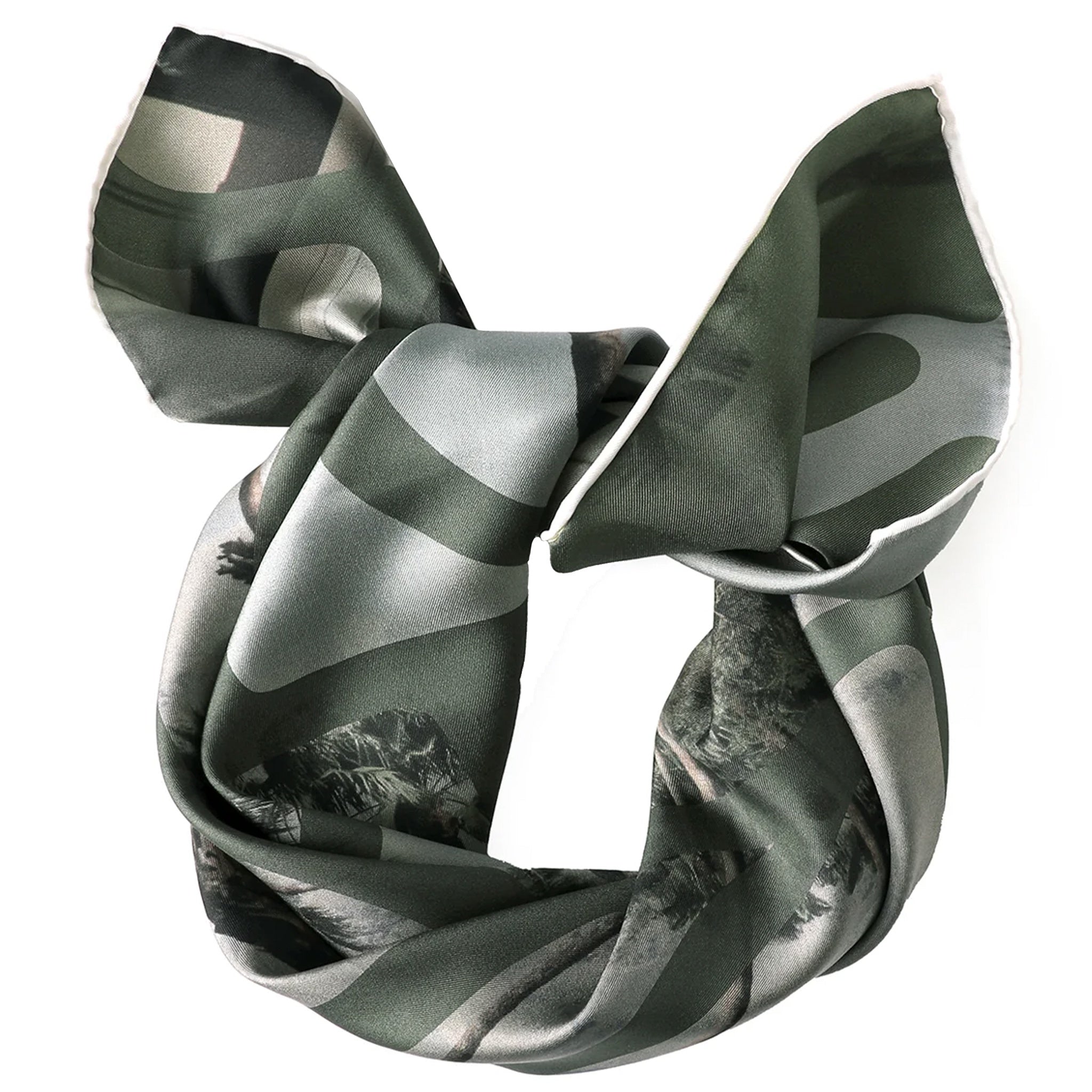 Green and gray patterned hair scrunchie on a white background