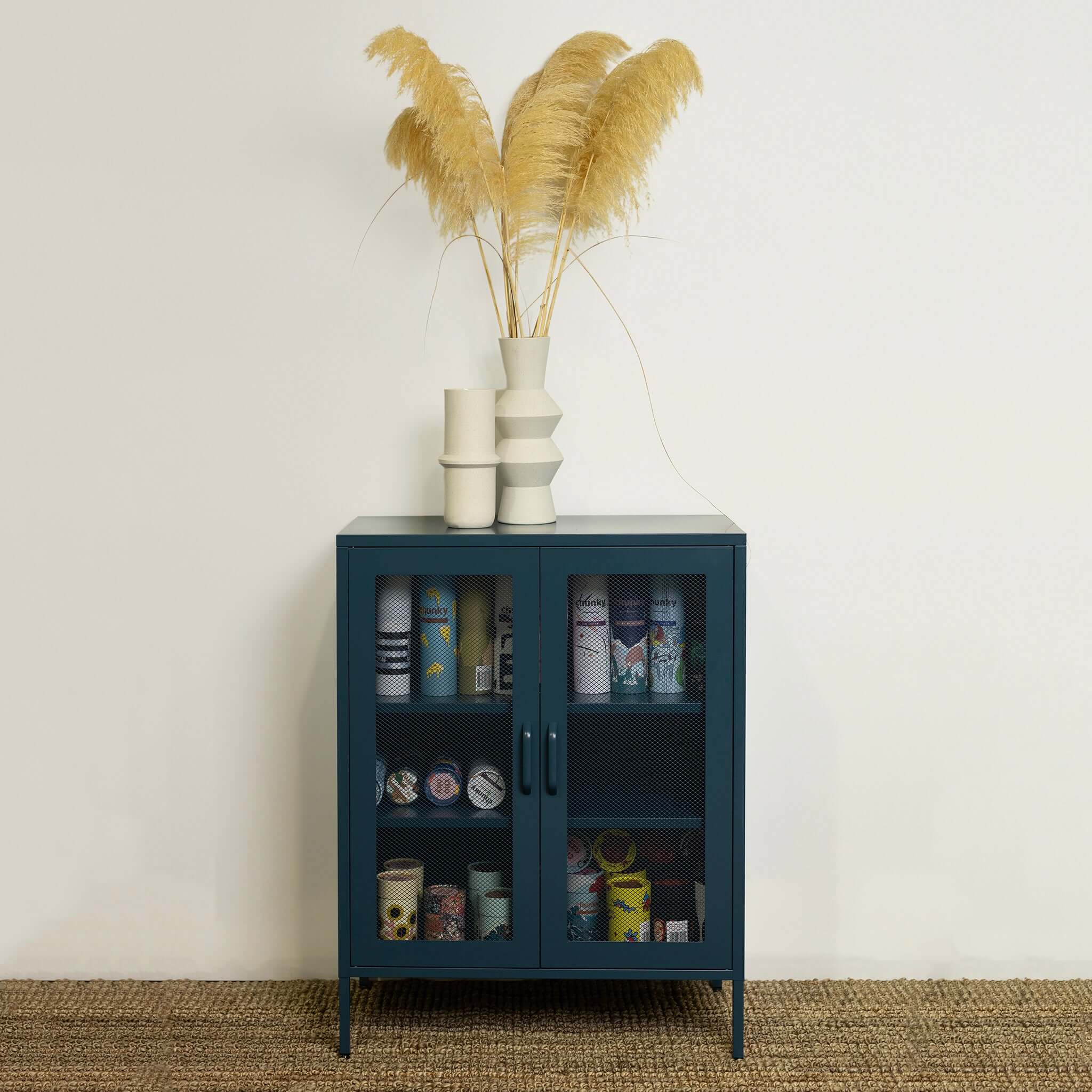 Good. Gertrude Contemporary Metal Locker with mesh doors, teal cabinet storage unit styled with vases and decor