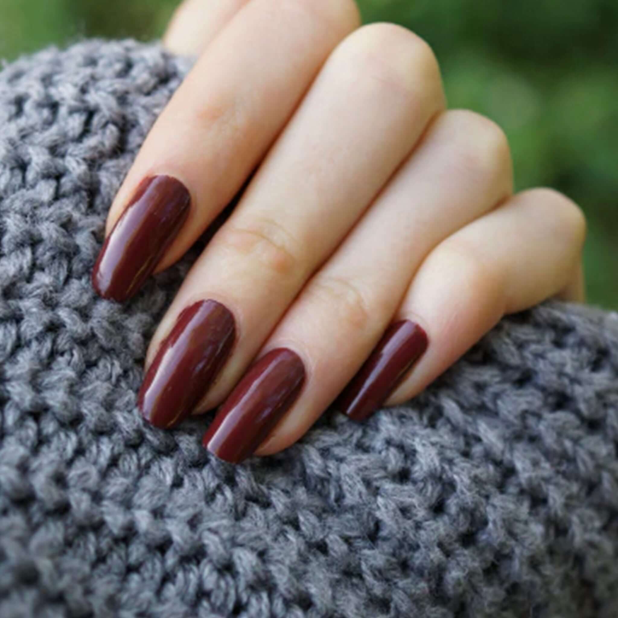 Alt Tag: Hanami Plant Based Nail Polish - Cortez deep burgundy manicure swatch on nails, vegan 21-free plant-based breathable nail colour