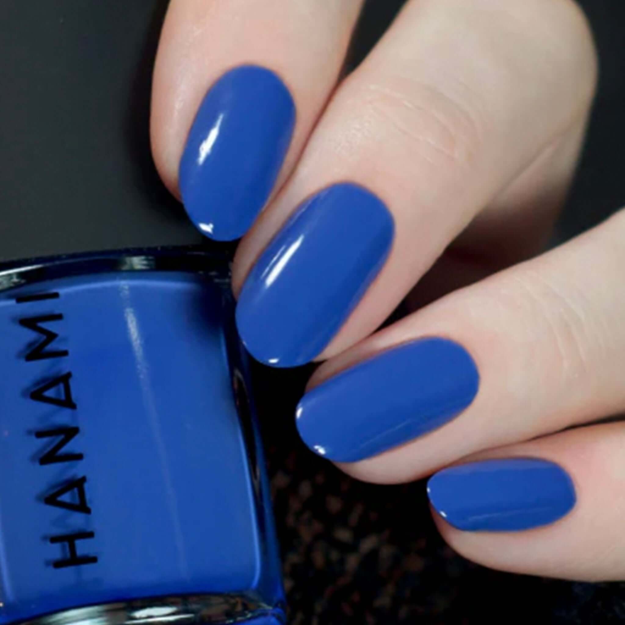 Alt Tag: Hanami Plant Based Nail Polish - Nocture blue vegan 21-free plant-based breathable nail polish 15ml bottle and manicure swatch