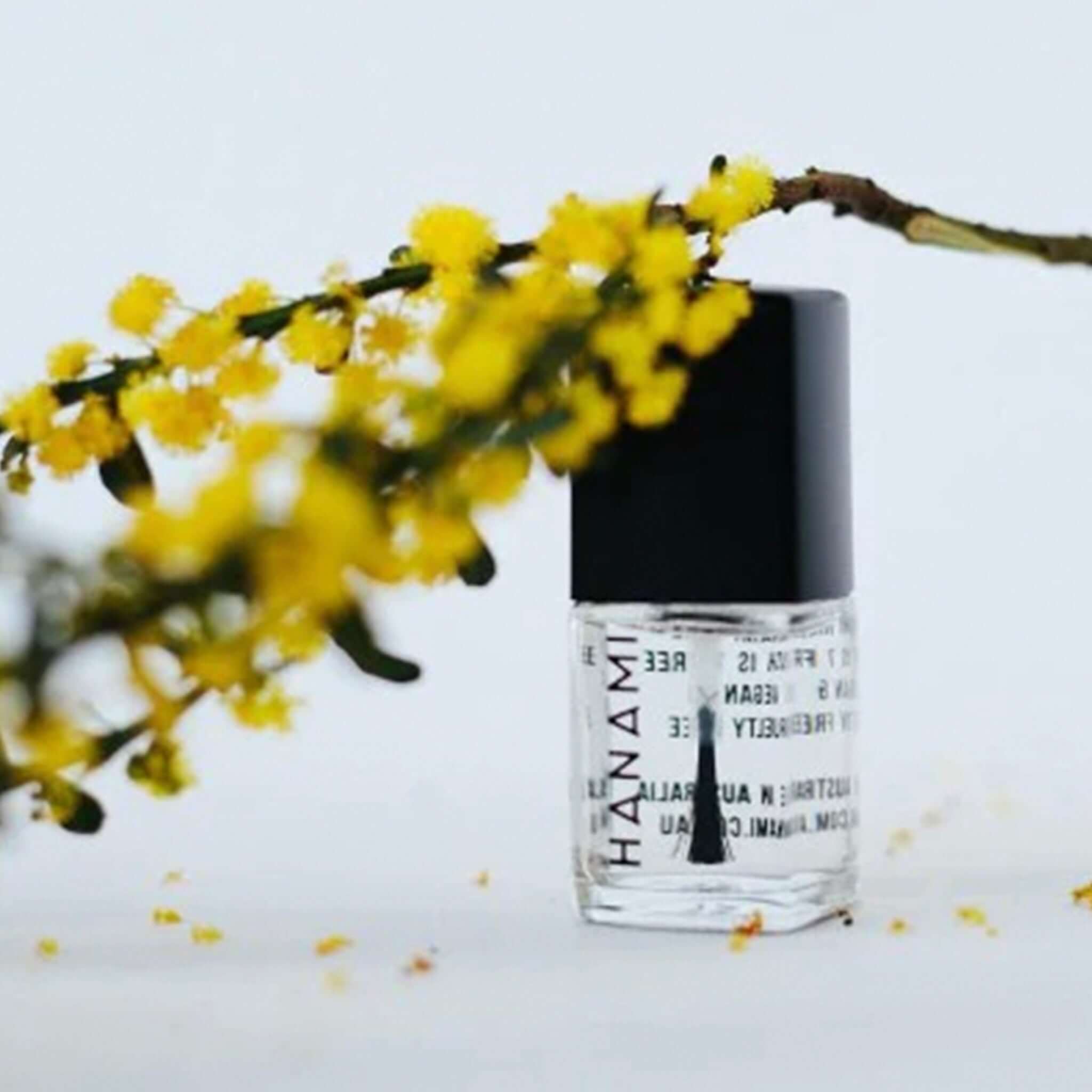 Alt Tag: Hanami Plant Based Nail Polish - Top + Base Coat 3-in-1 strengthening treatment, smoothing base coat and glossy top coat bottle