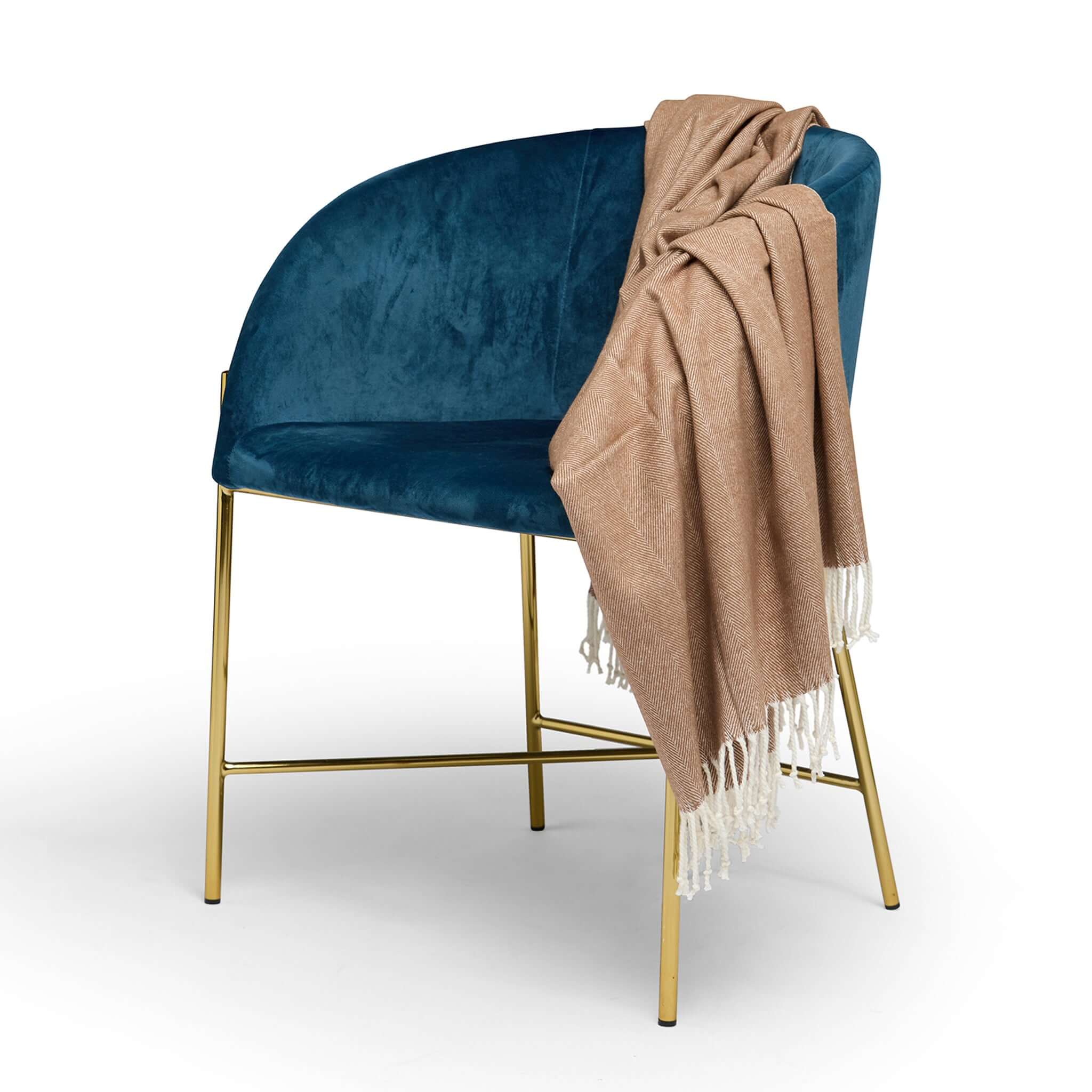 Esperance & Co Herringbone Throw - Toffee draped over blue velvet chair, soft lightweight cotton throw blanket with fringe for couch or picnic