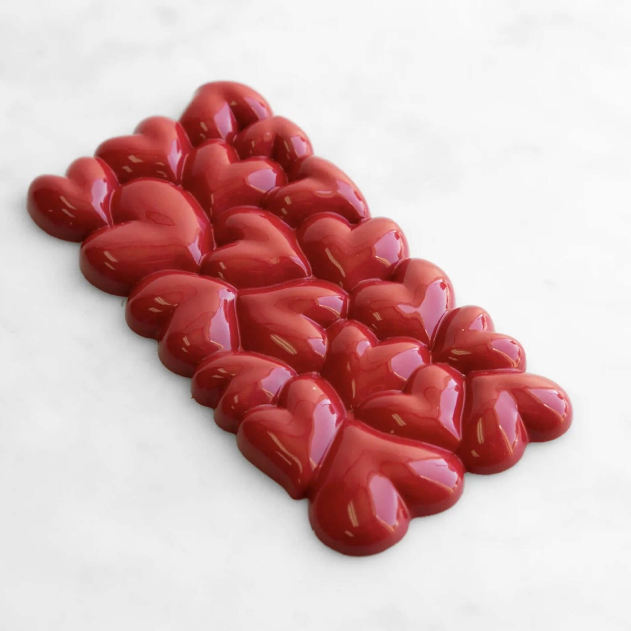 Alt Tag: House of Chocolate Love Heart Hazelnut Milk Chocolate Bar heart-shaped milk chocolate bar on marble background