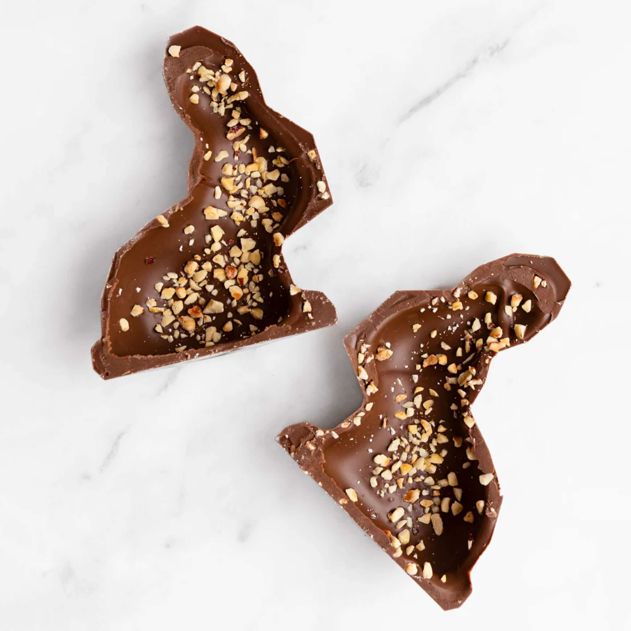 Alt Tag: House of Chocolate Hazelnut Milk Chocolate Bunny halves with Marlborough hazelnut pieces on creamy 37% milk chocolate