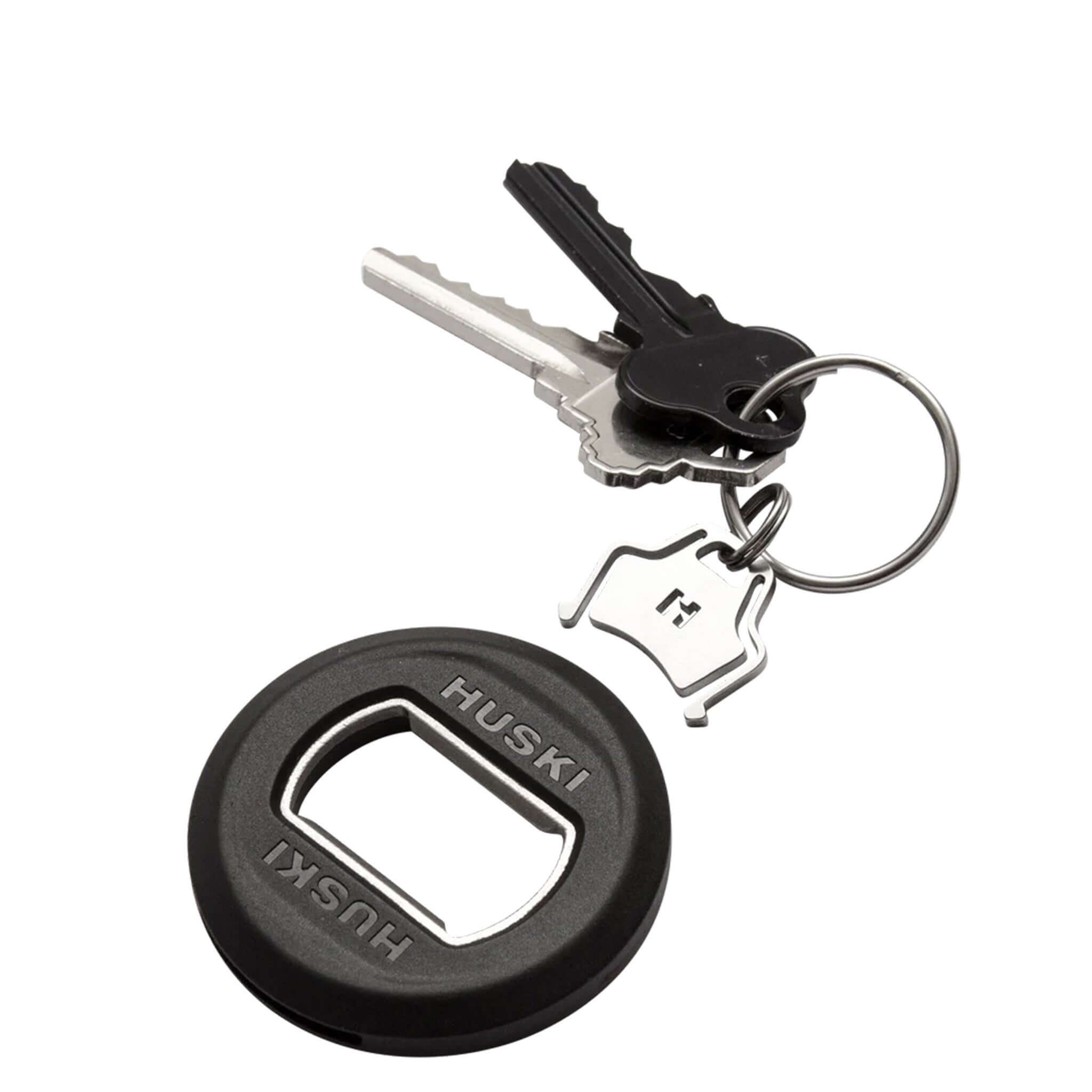 Huski 3-in-1 Bottle Opener Keyring attached to keys, showcasing its sleek design and utility.