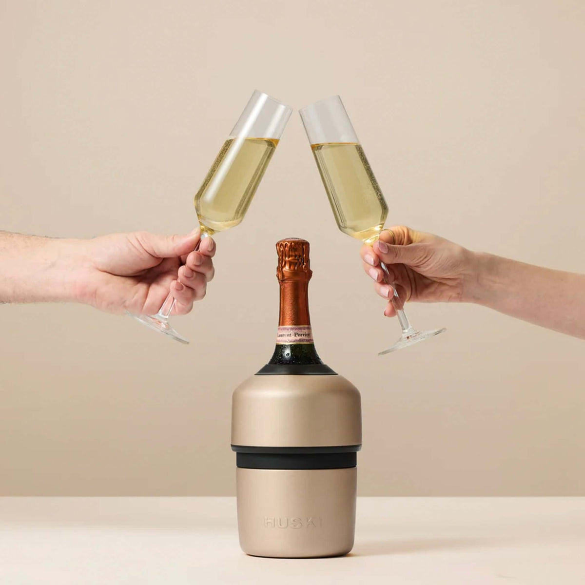 Huski Champagne Cooler - Champagne with two glasses clinking and a bottle of champagne.
