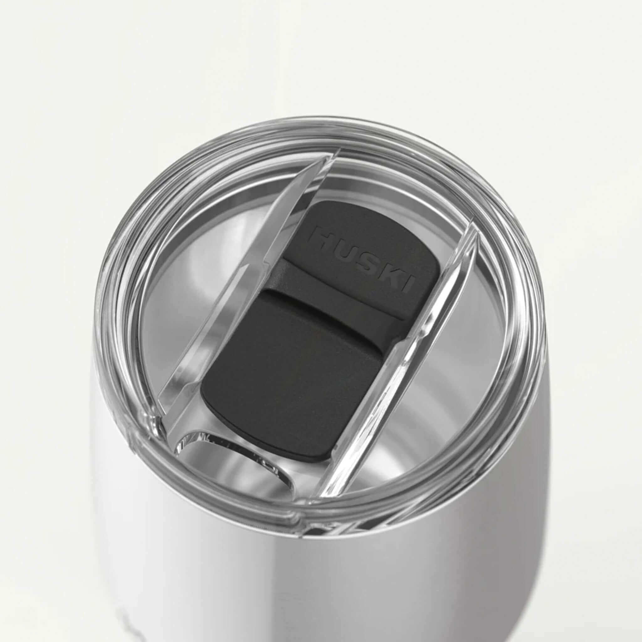 Close-up of the Huski Wine Tumbler 2.0 - Champagne lid featuring EasySlider™ technology.