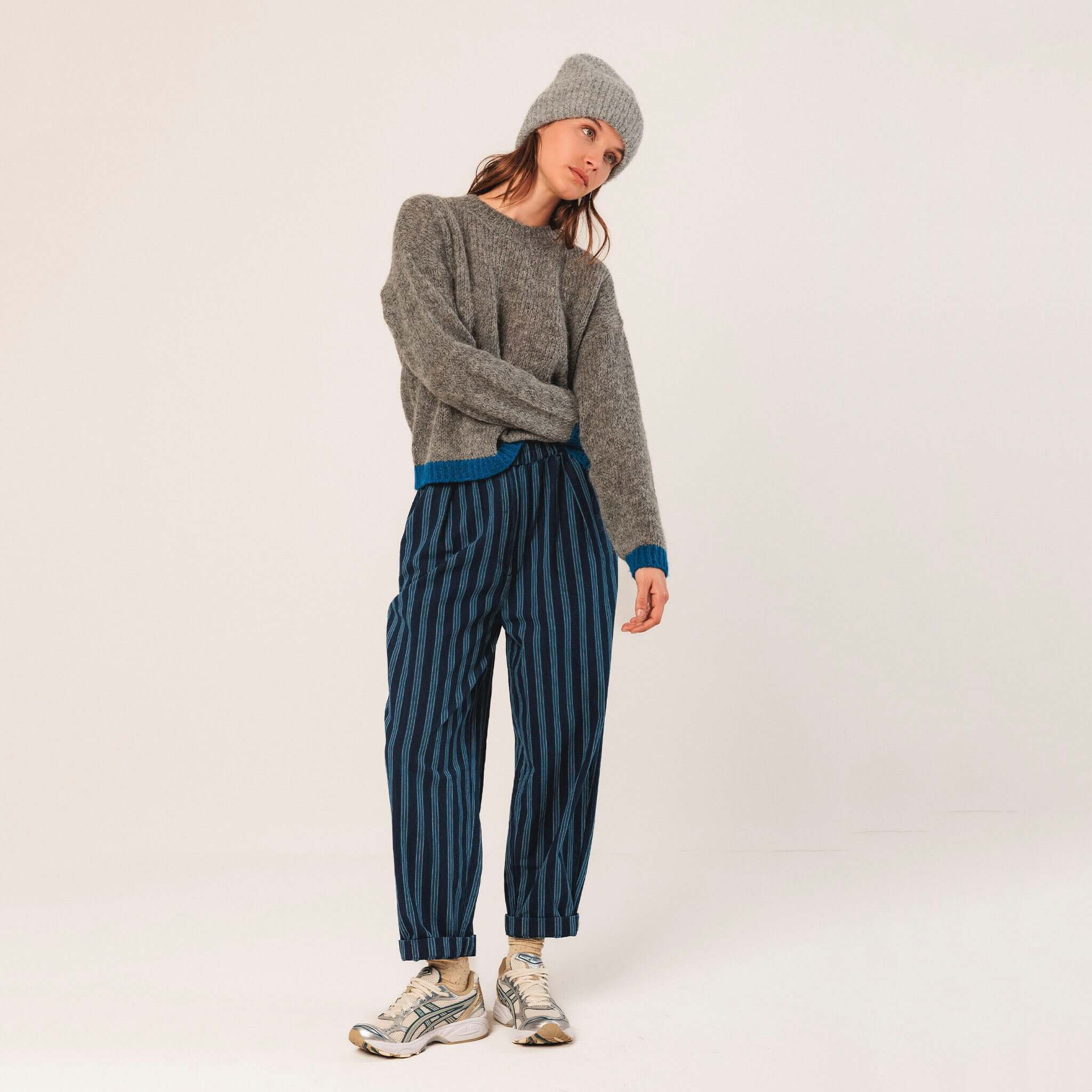 Alt Tag: Indi & Cold Alpaca Blend Jersey - Marengo grey relaxed knit sweater with bright cuff and hem colour pop, styled with striped trousers
