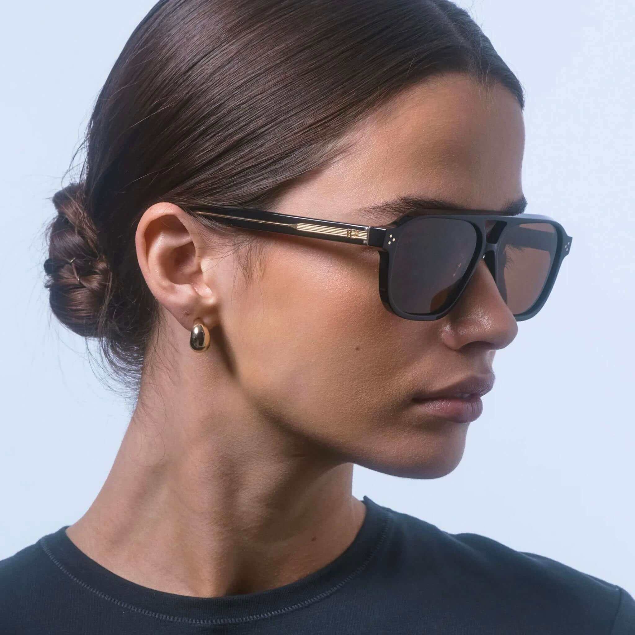 Alt Tag: Isle of Eden Sunglasses - Remi Whiskey Tortoise worn in side profile, modern aviator with double bridge, whiskey tortoise bio-acetate frame