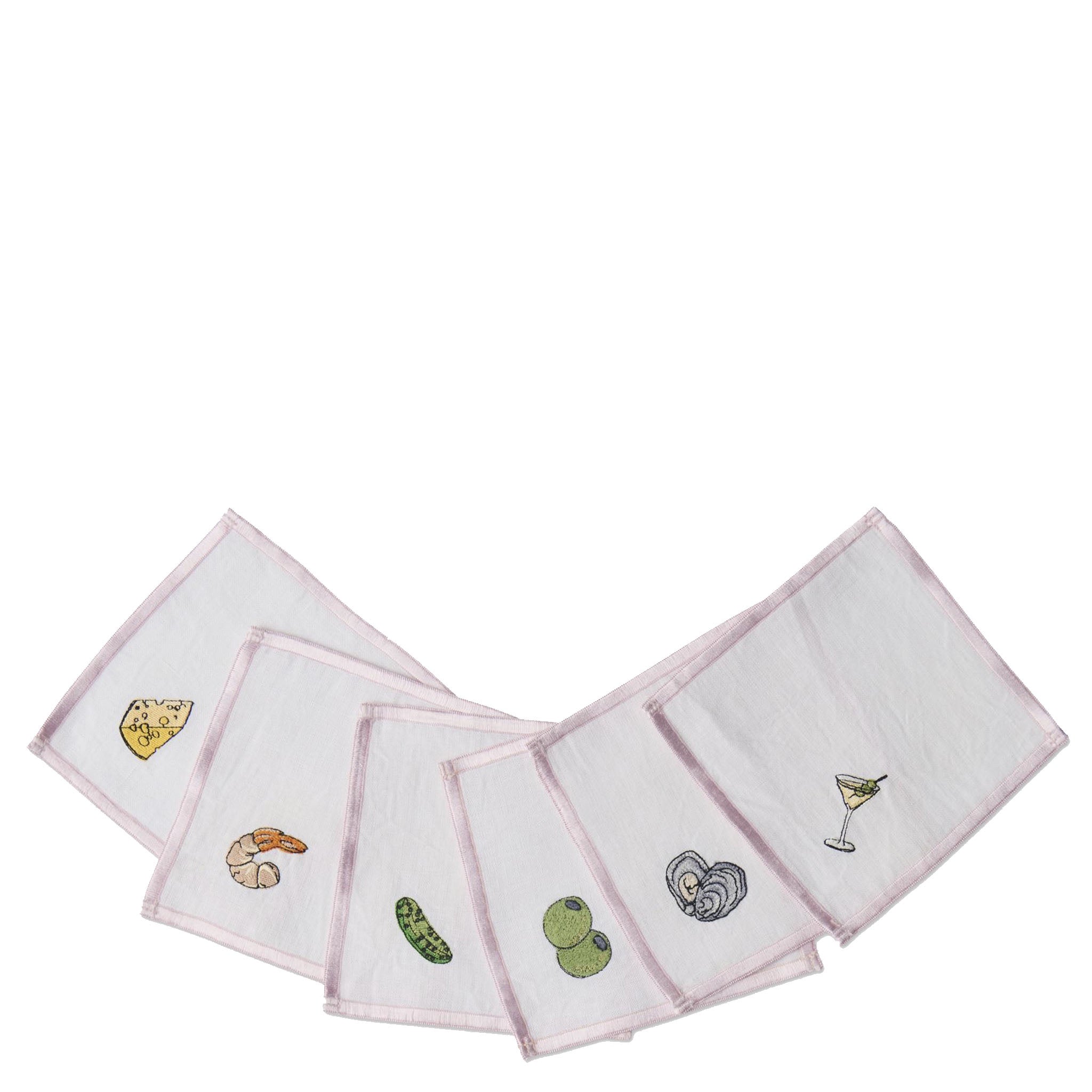 Set of pink napkins with embroidered designs on a white background