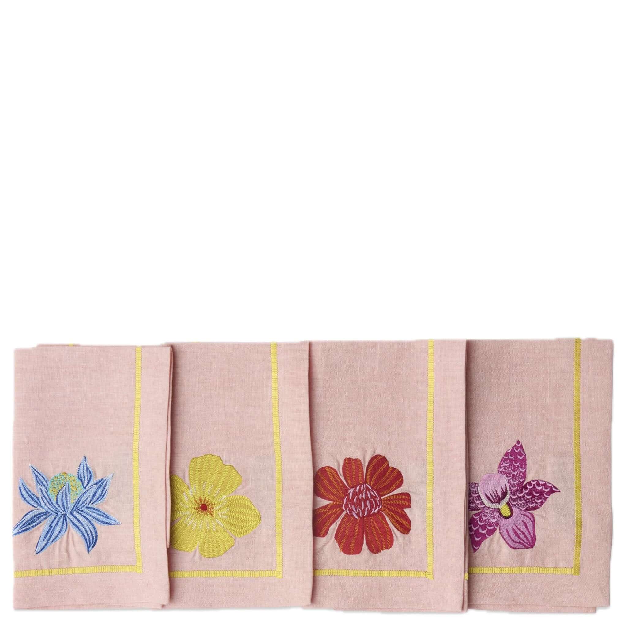 Set of four pink napkins with colorful floral embroidery on a white background