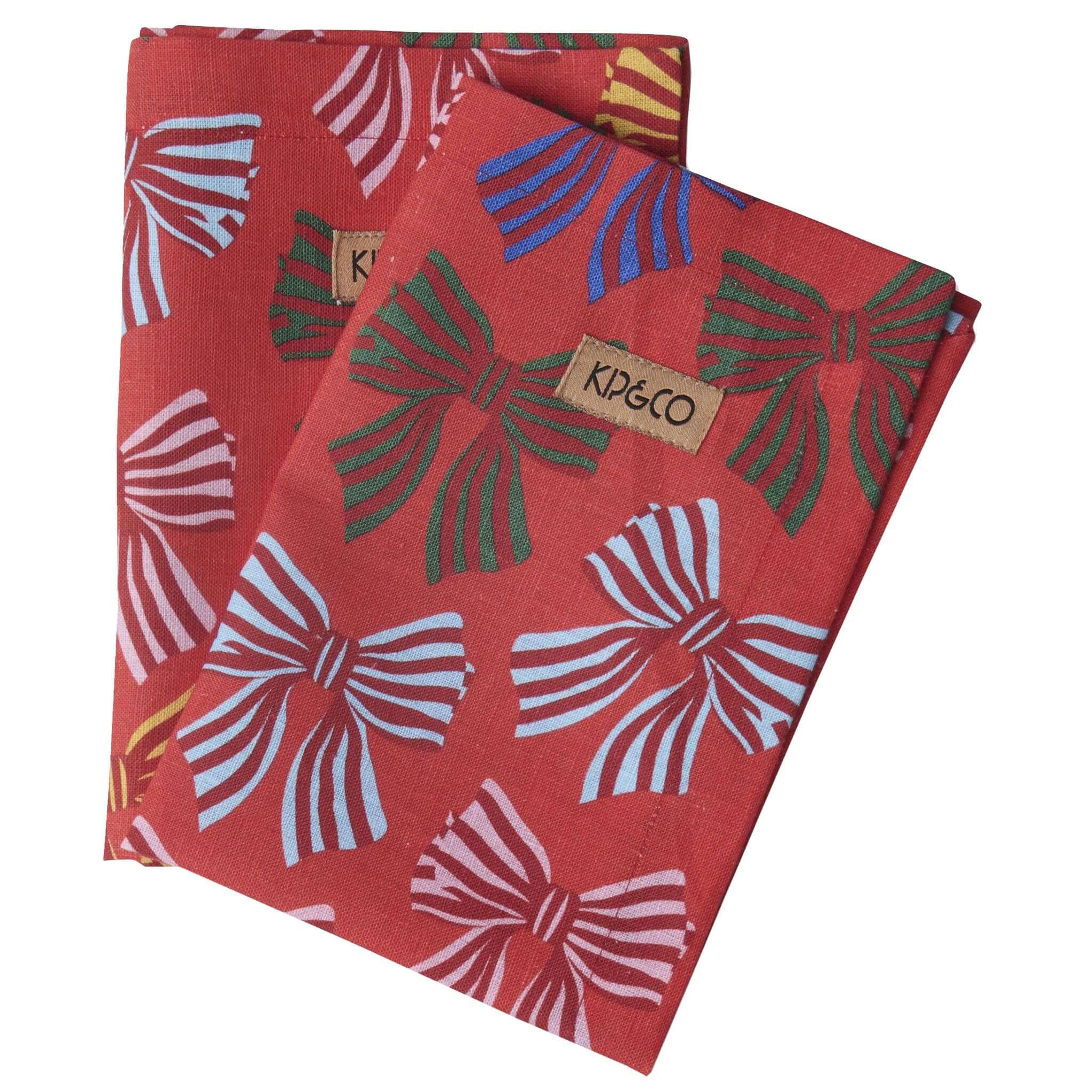 Red Napkins with bow pattern and Kip & Co label on a white background