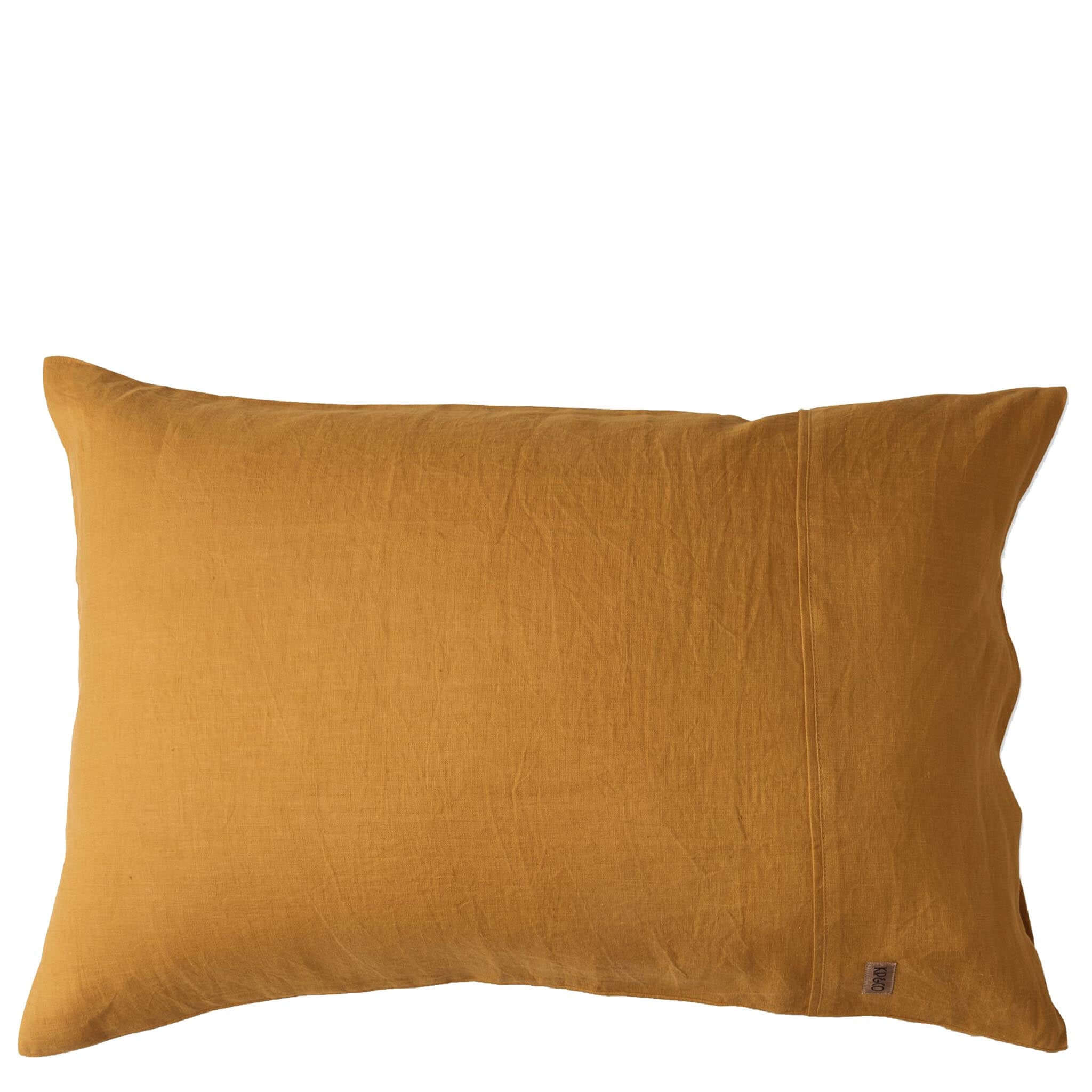 Mustard yellow pillow on a white background