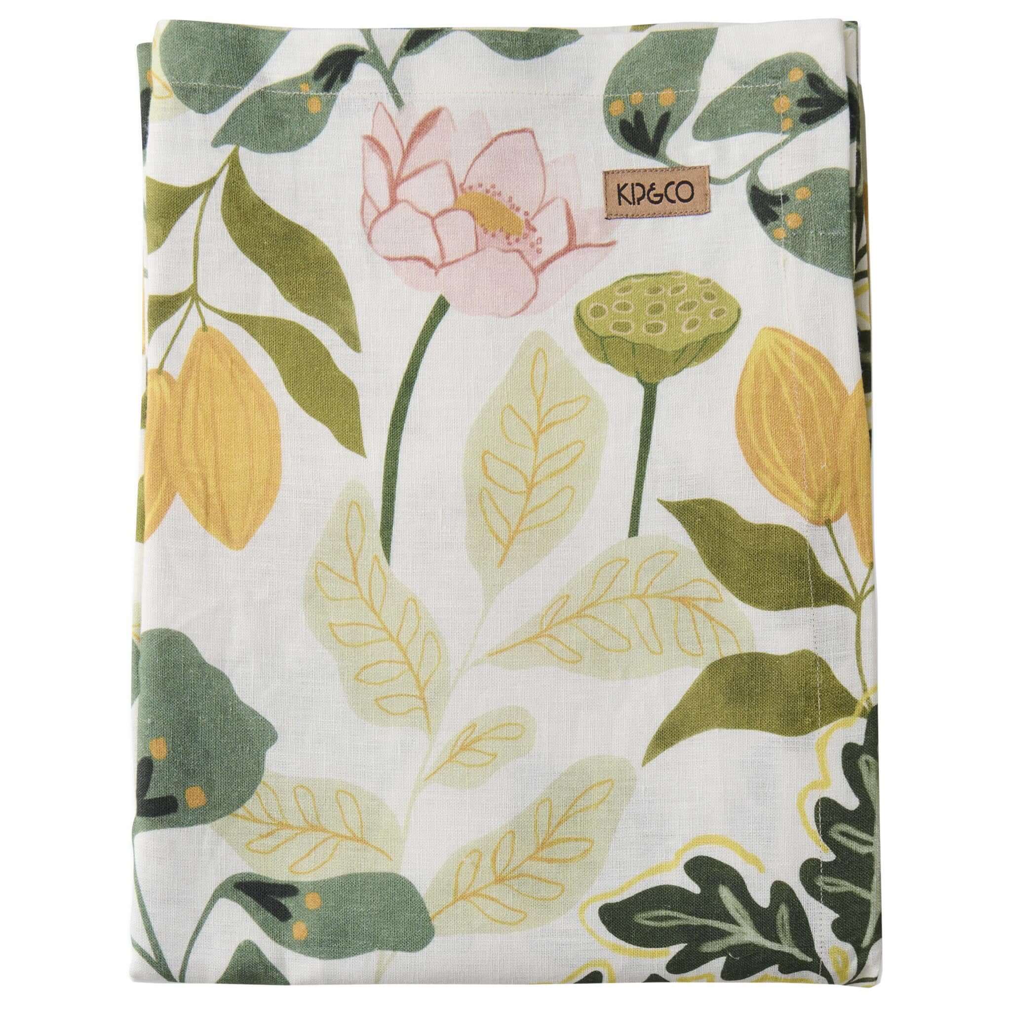 Floral and leaf patterned tablecloth with 'Kip & Co' branding on a white background