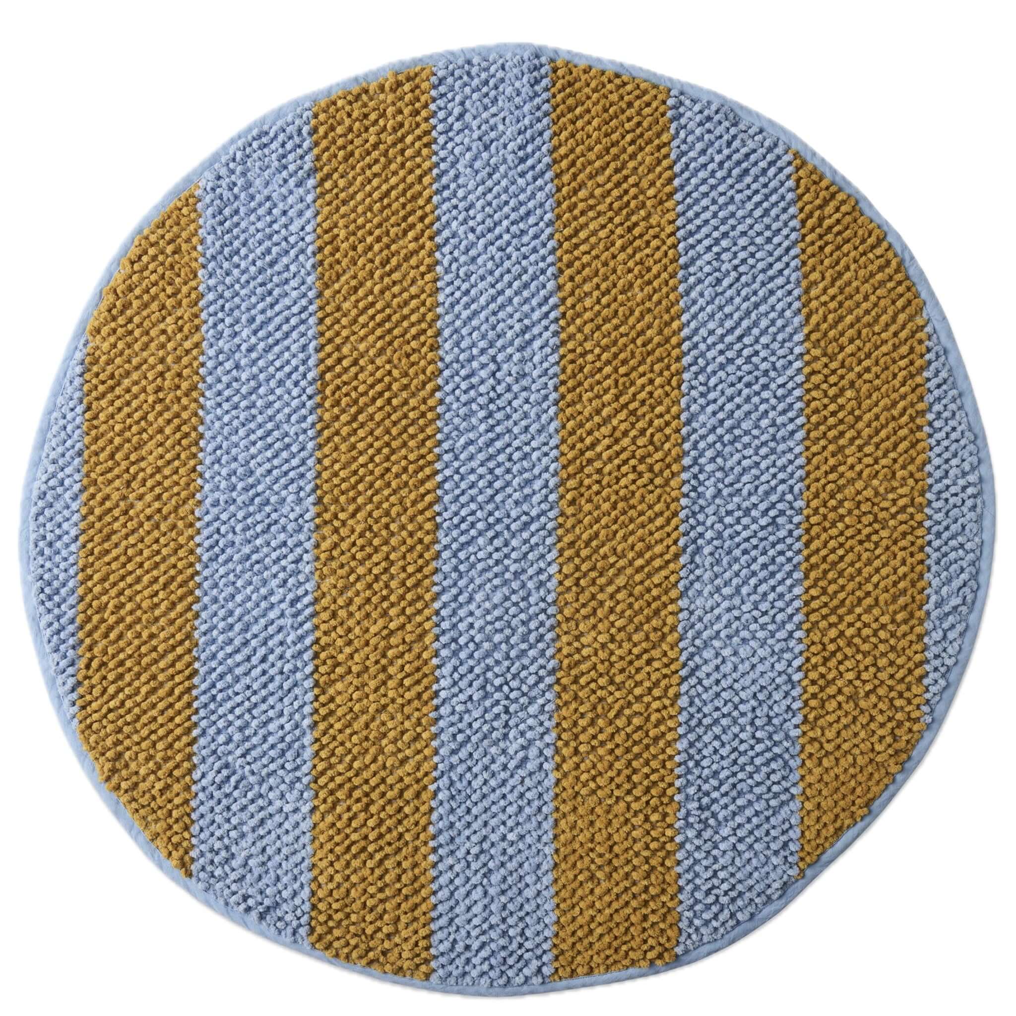 Round bath mat with blue and mustard yellow stripes on a white background