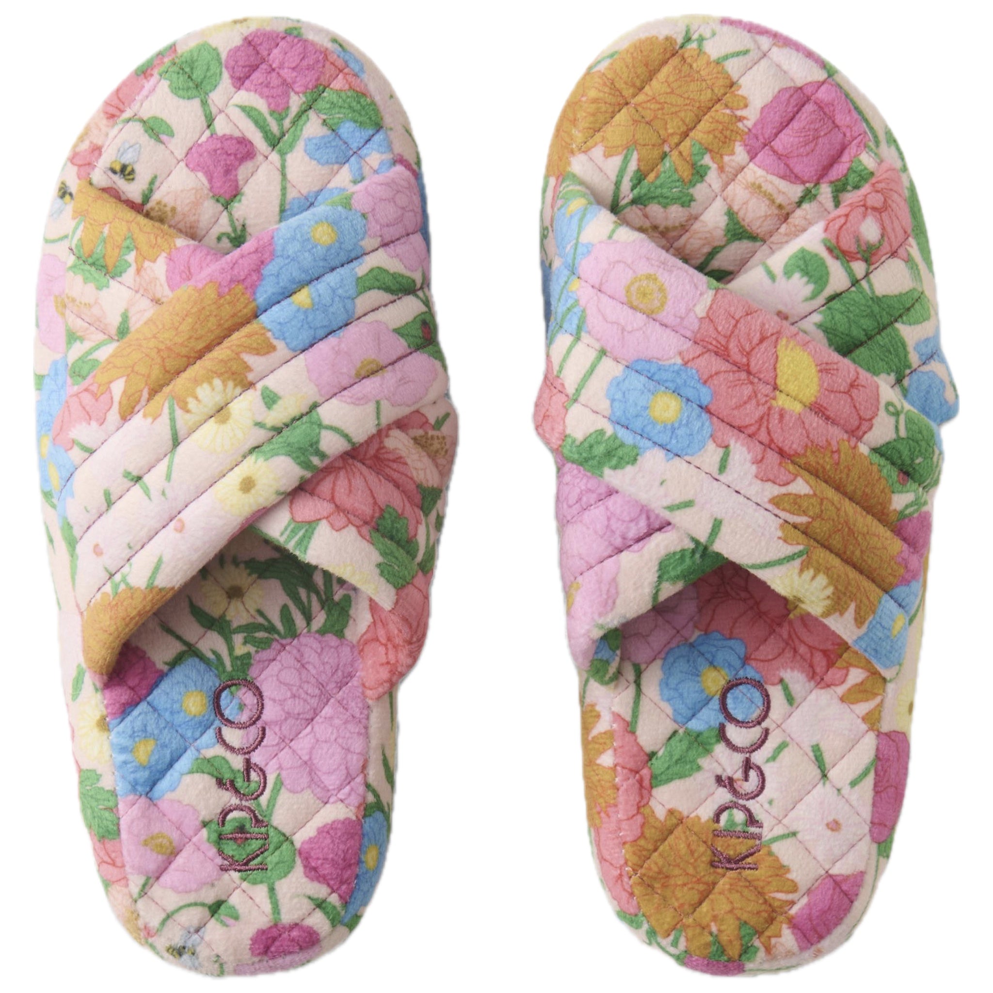 Pair of floral-patterned slippers with 'Kip & Co' branding on a white background