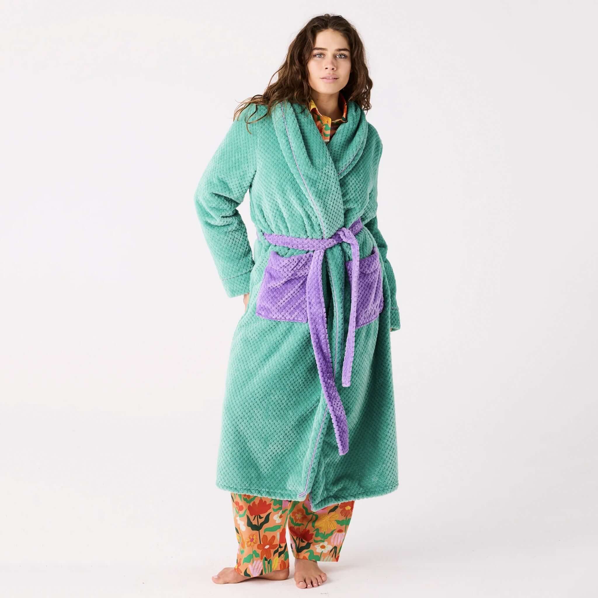 Alt Tag: Model wearing Kip & Co Cosy Robe - Tropicas in mint green with purple belt, soft lightweight recycled eco robe for lounging