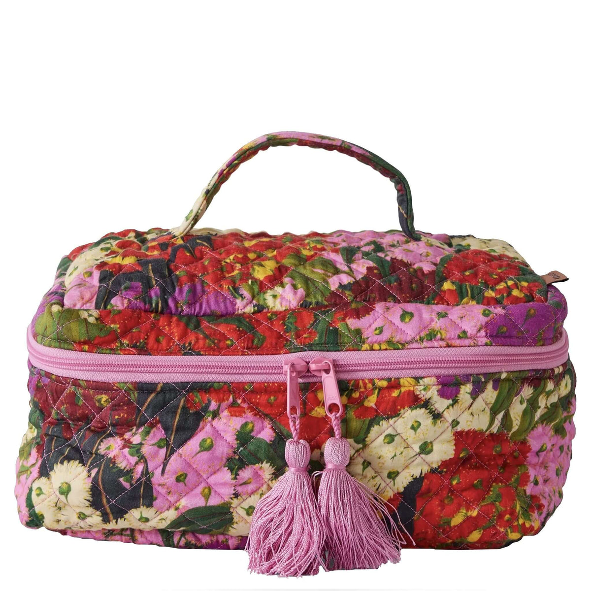 Kip & Co Quilted Toiletry Case - Bush Blossom in vibrant floral pattern with pink tassels and zipper.
