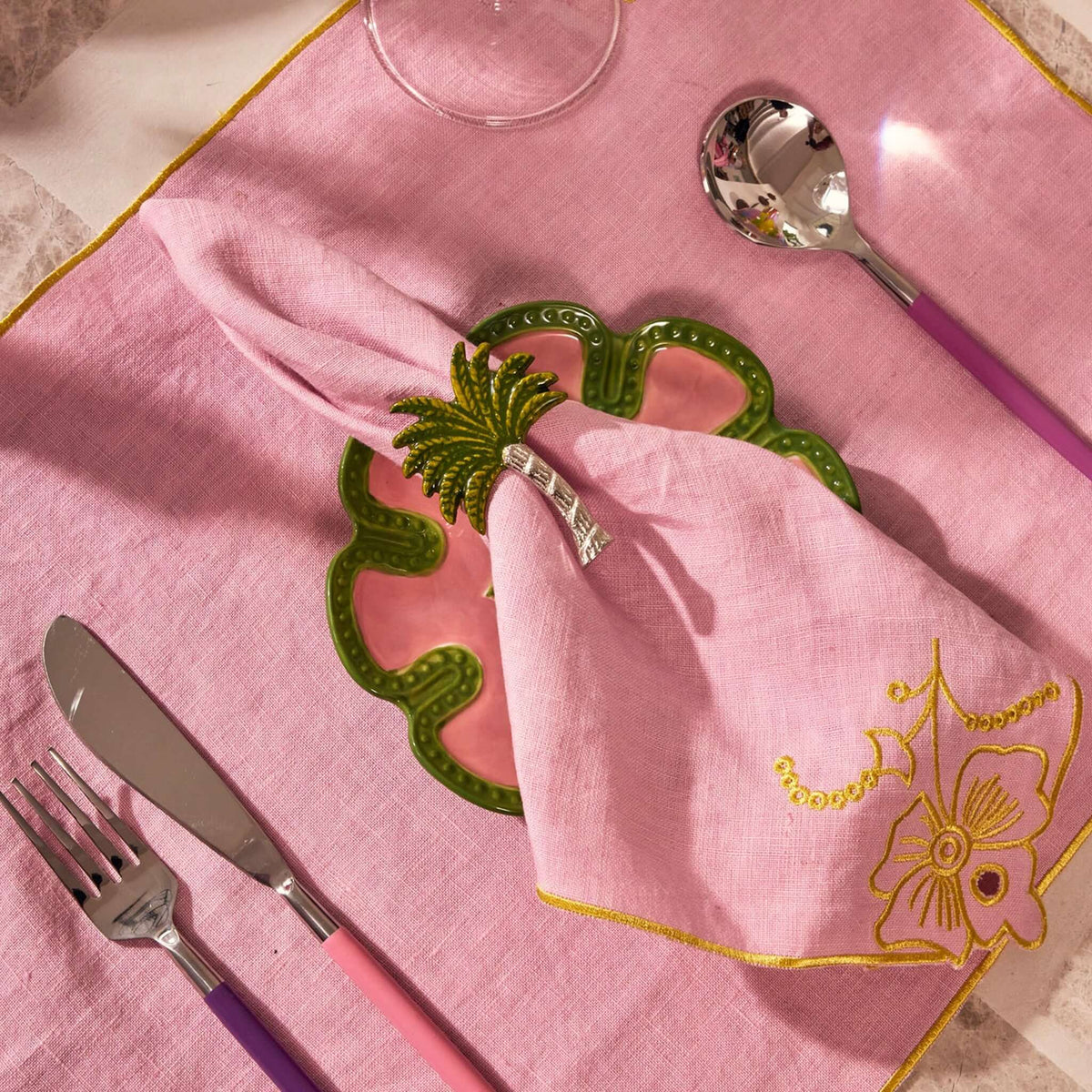 Kip & Co Embroidered Linen Napkin Set - Pink Tuscan styled with cutlery on a vibrant table setting.