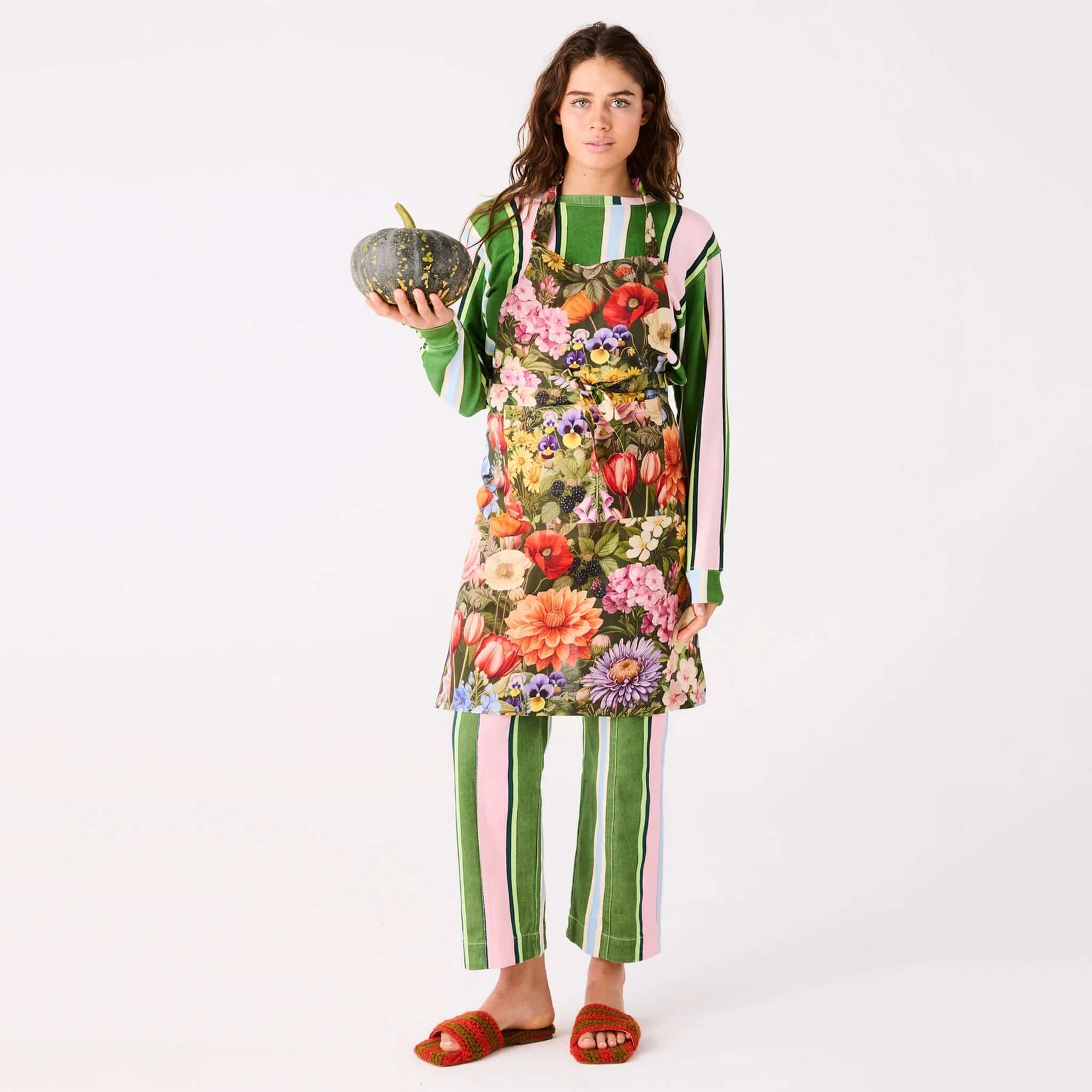 Alt Tag: Kip & Co Linen Apron - Cottage Garden Eden floral French flax linen apron worn by model holding pumpkin, soft durable carbon neutral