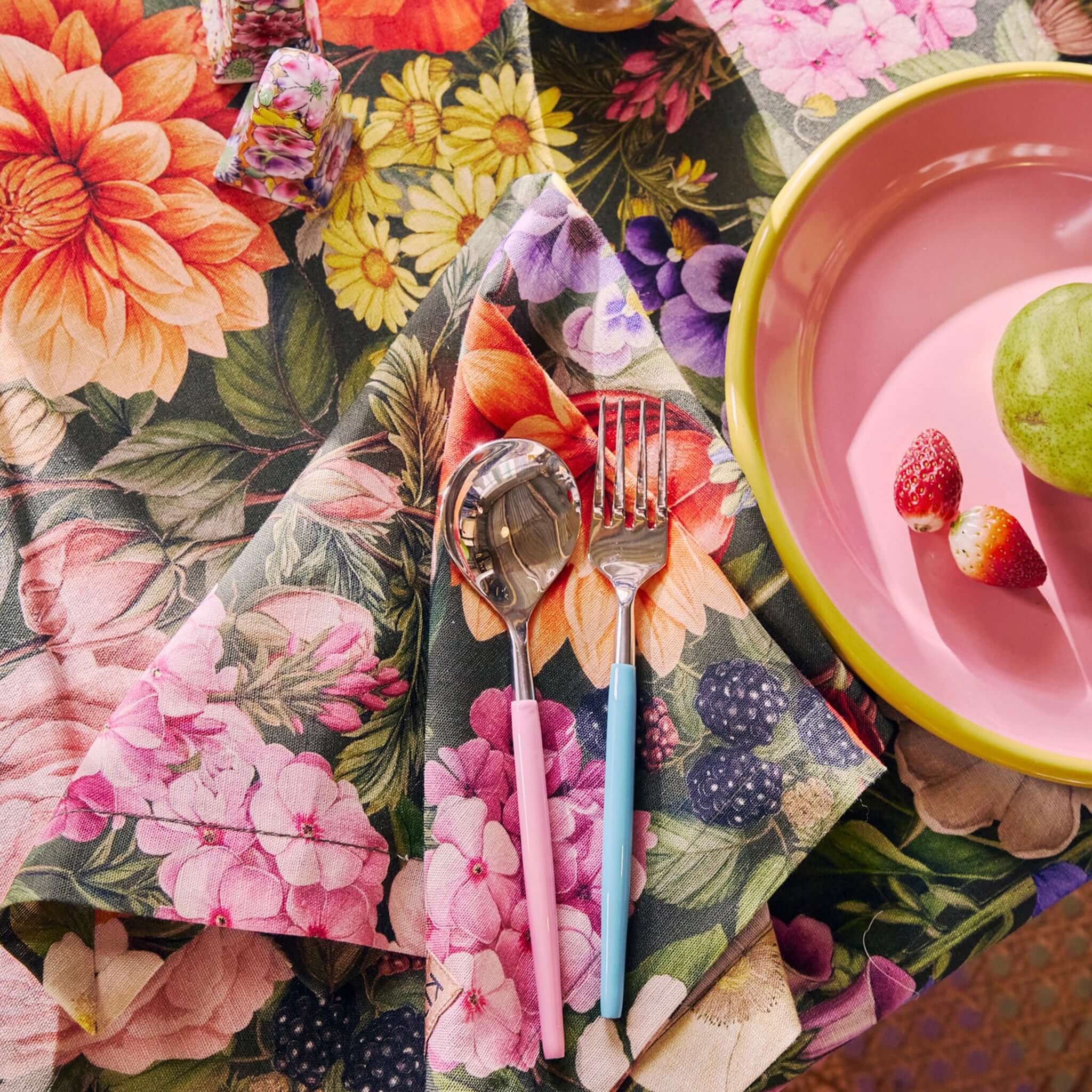 Alt Tag: Kip & Co Linen & Cotton Napkin Set - Cottage Garden Eden floral napkins on table with cutlery and pink plate, garden party setting