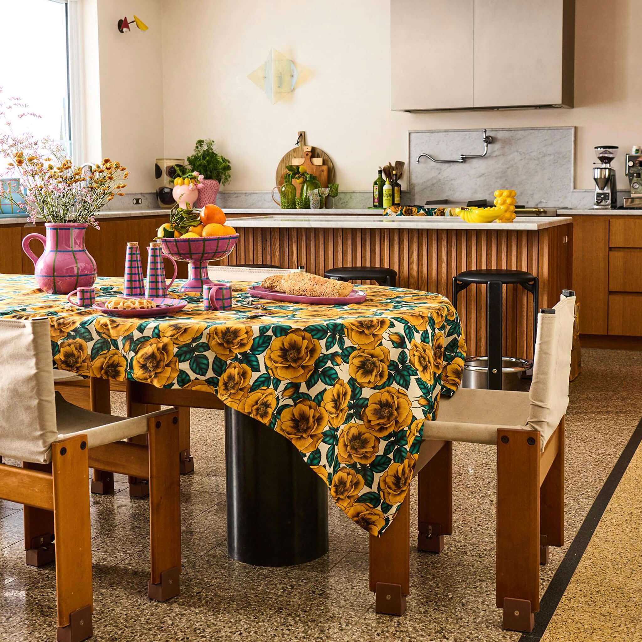 Alt Tag: Kip & Co Linen & Cotton Tablecloth - Golden Peony on dining table, golden peonies with blue leaves on white base in modern kitchen