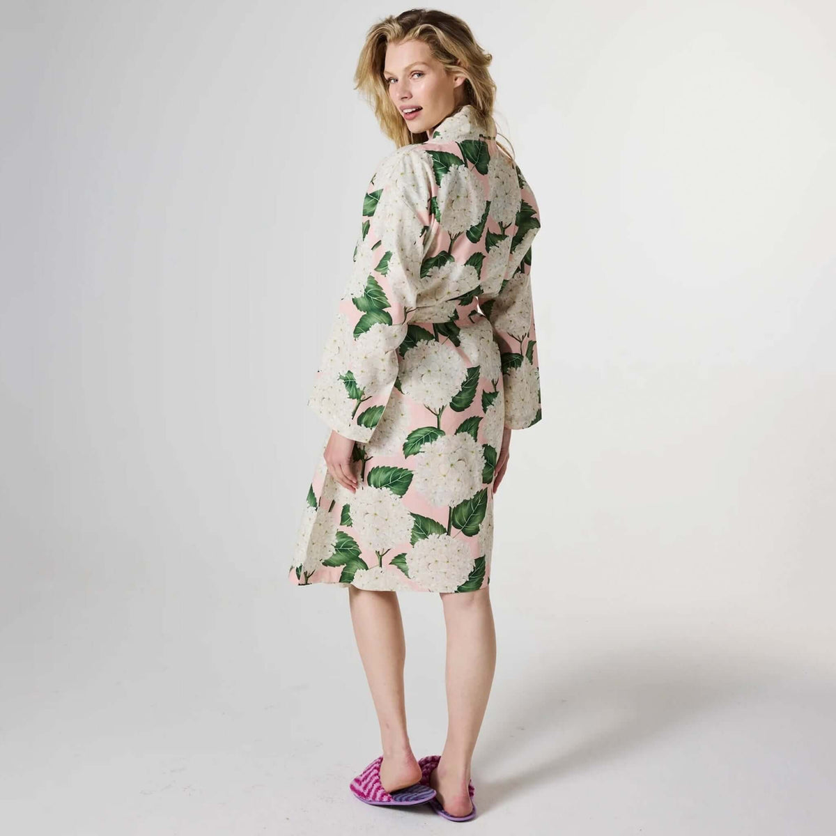 Kip & Co Linen Robe - Hydrangea Pink worn by model, showcasing floral design and relaxed fit.