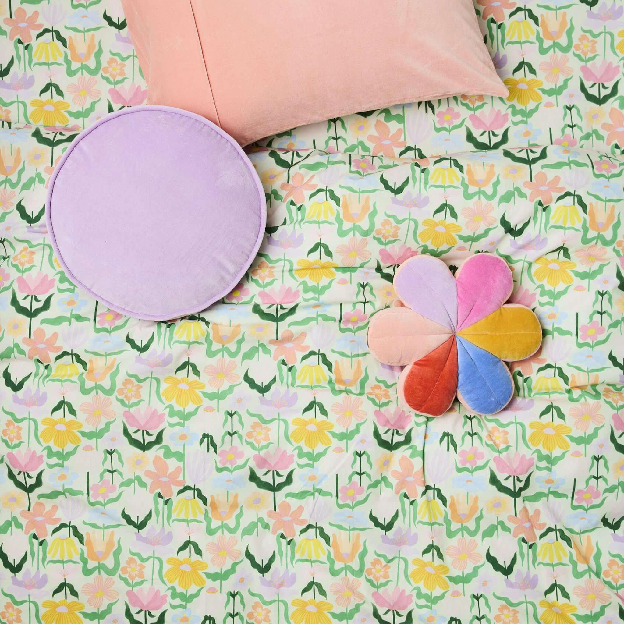 Alt Tag: Kip & Co Organic Cotton Baby Fitted Cot Sheet - Popping Flowers Green with pastel floral print bedding in nursery