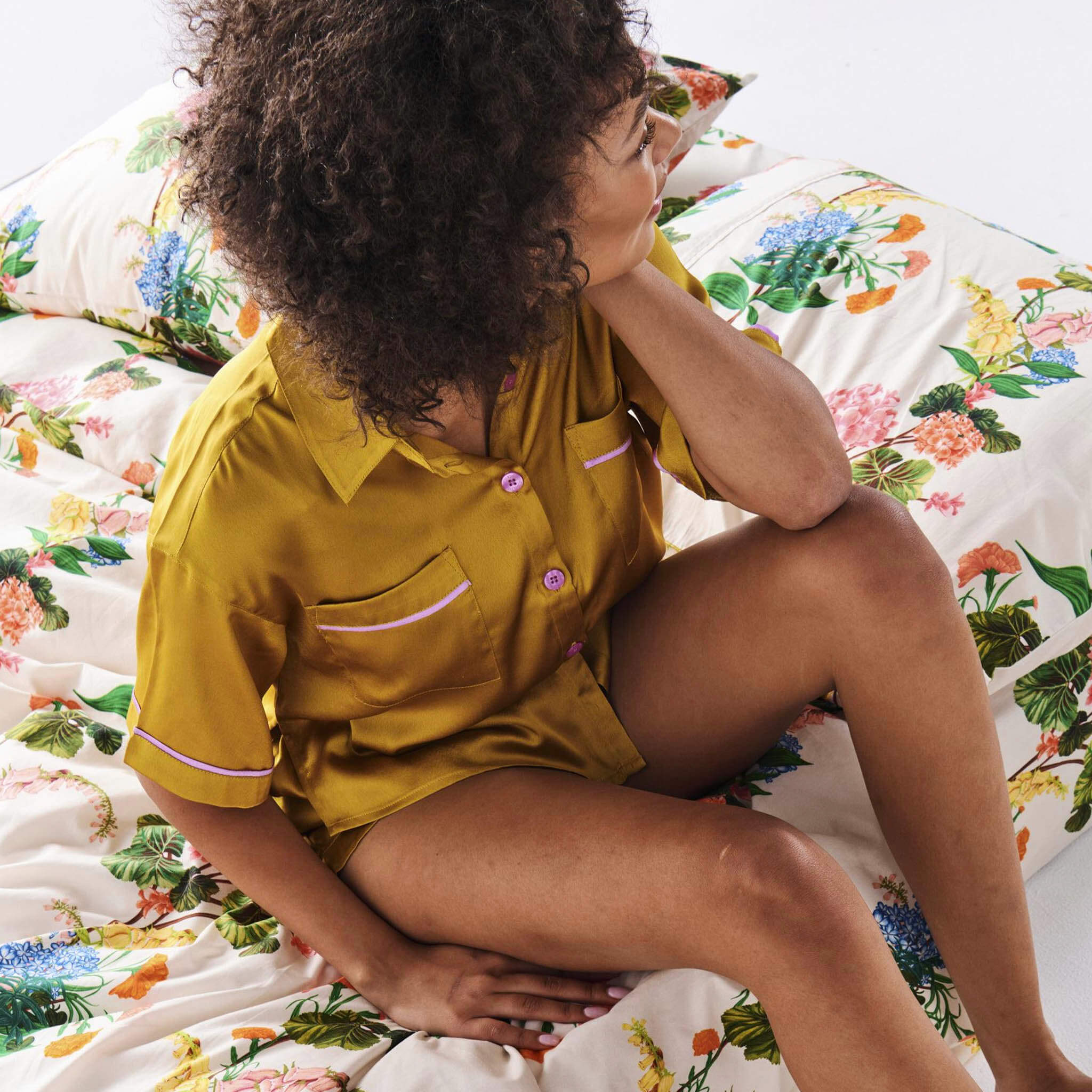 Alt Tag: Kip & Co Satin Short Sleeve Shirt & Pants Pyjama Set - VaVaVoom gold satin short sleeve pajama shirt with violet buttons