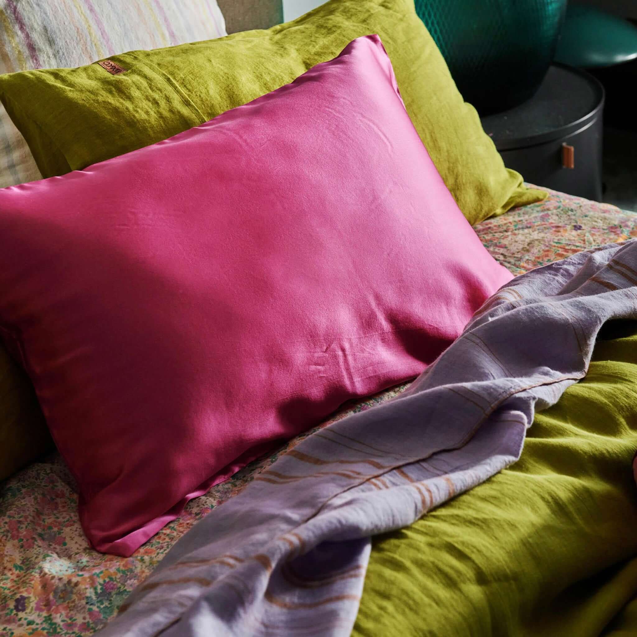Alt Tag: Kip & Co Silk Pillowslip - Perfect Pink mulberry silk pillowcase on bed, smooth 22 momme silk for glossy hair and skin