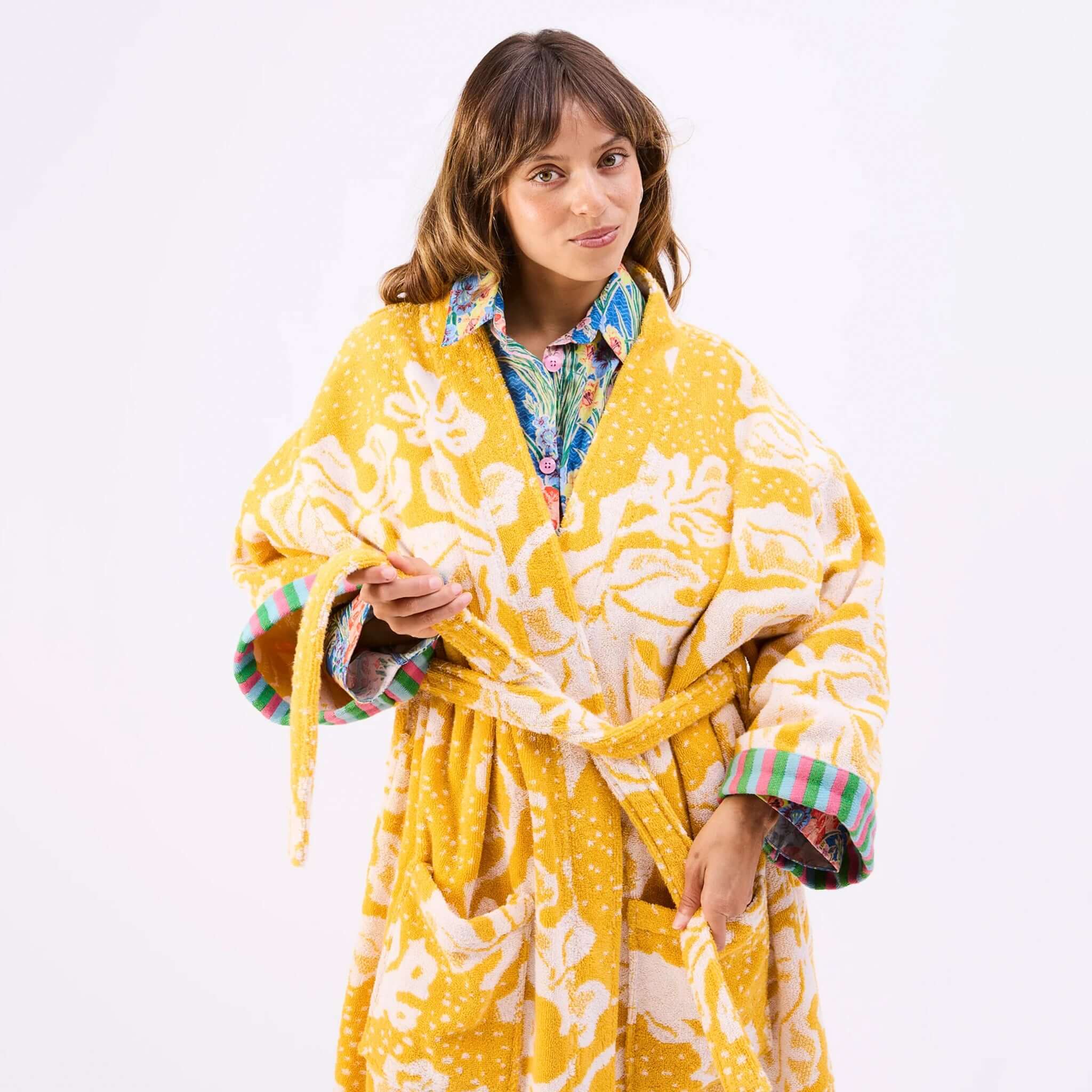 Model wearing the Kip & Co x Anna Spiro Elsternwig Fig Terry Bath Robe in vibrant colors.