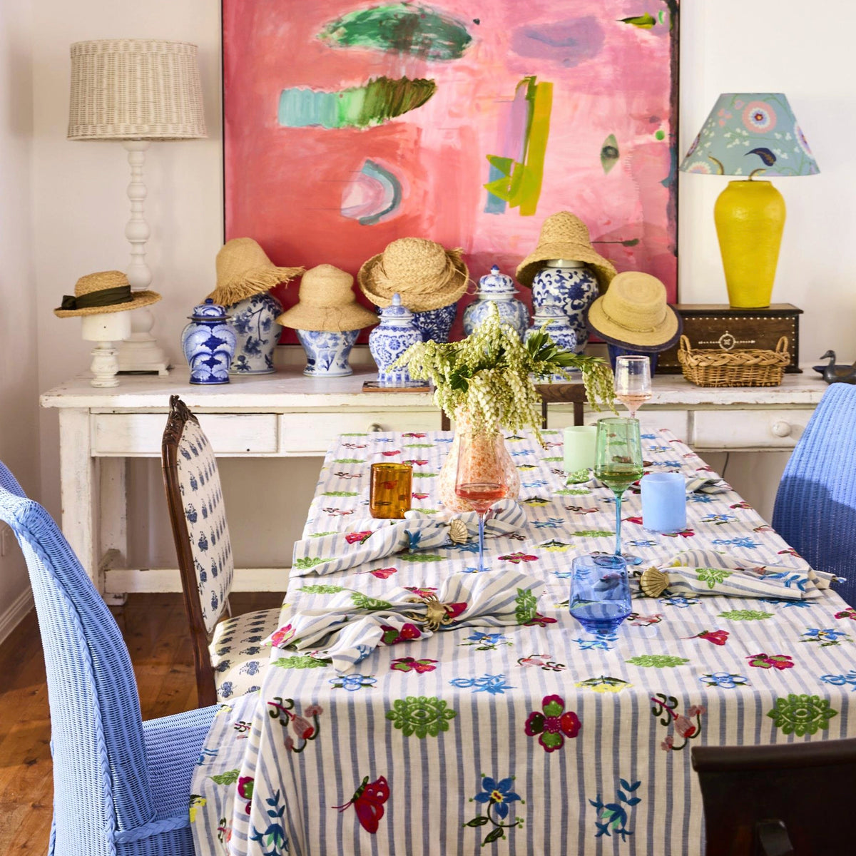 Kip & Co x Anna Spiro Tablecloth - Malabar Floral on a dining table with coloured glassware and china