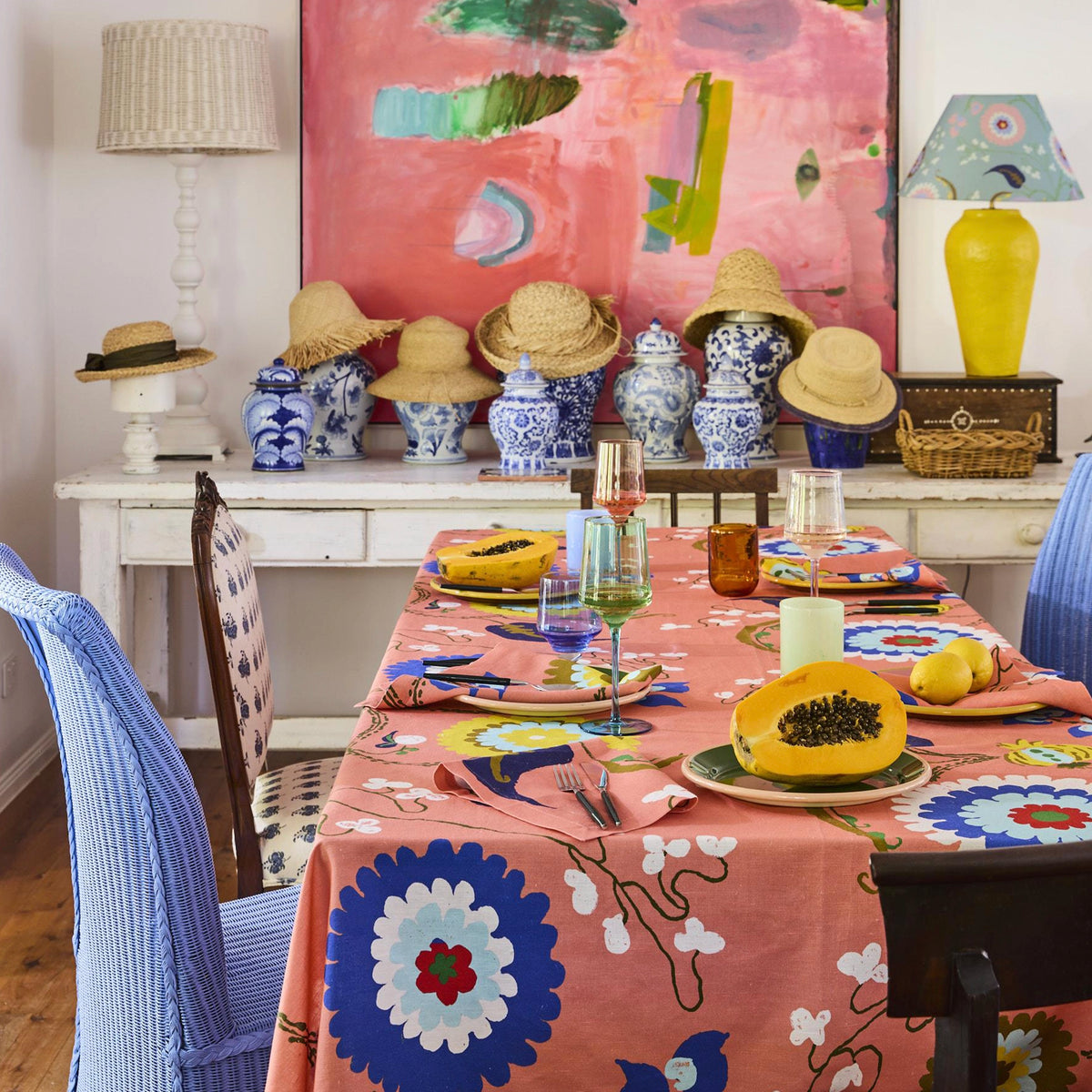 Kip & Co x Anna Spiro Isabelle Sunset linen on a dining table set with papaya, glassware and blue-and-white china