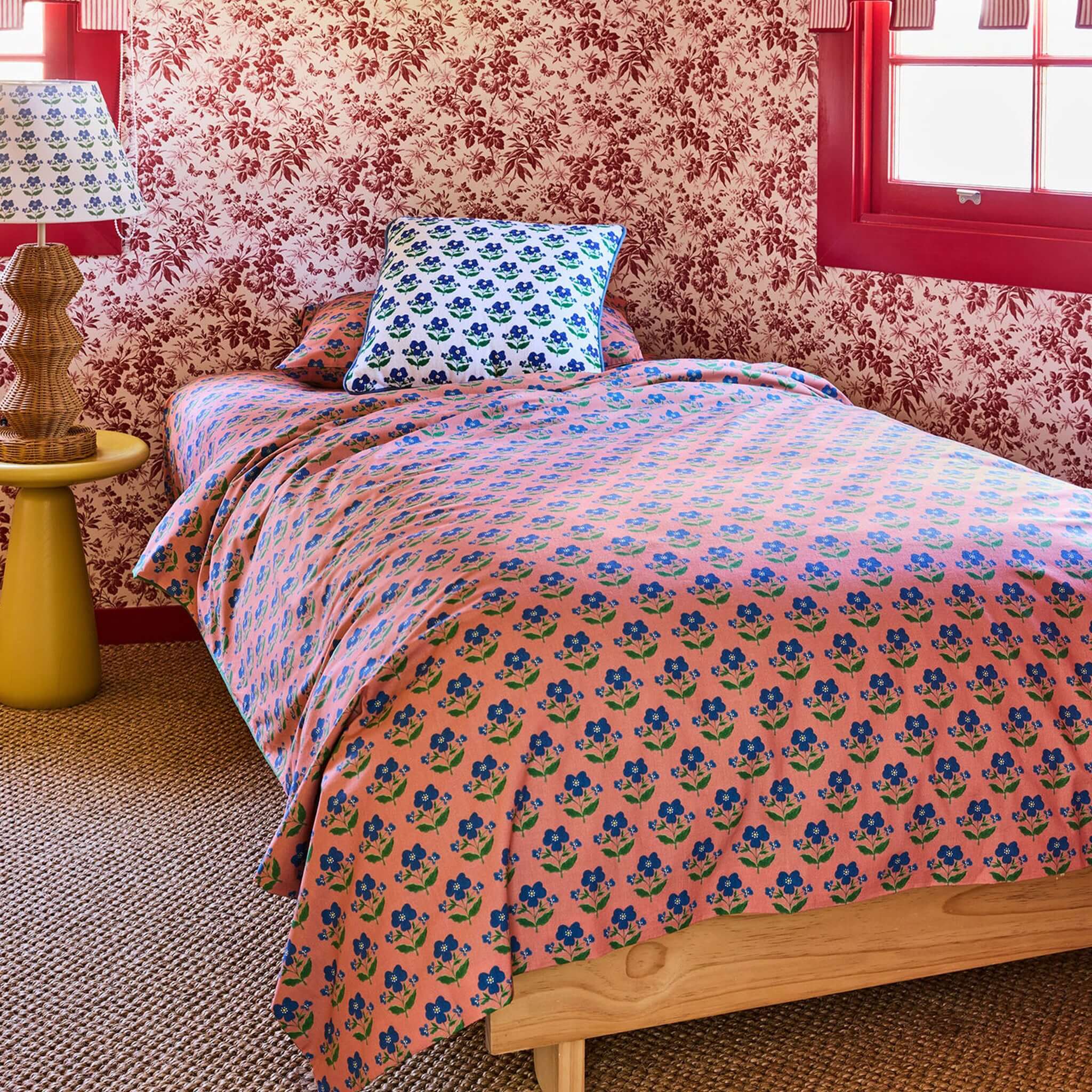 Kip & Co x Anna Spiro Organic Cotton Duvet Cover - Indian Summer Pink styled in a vibrant bedroom setting.