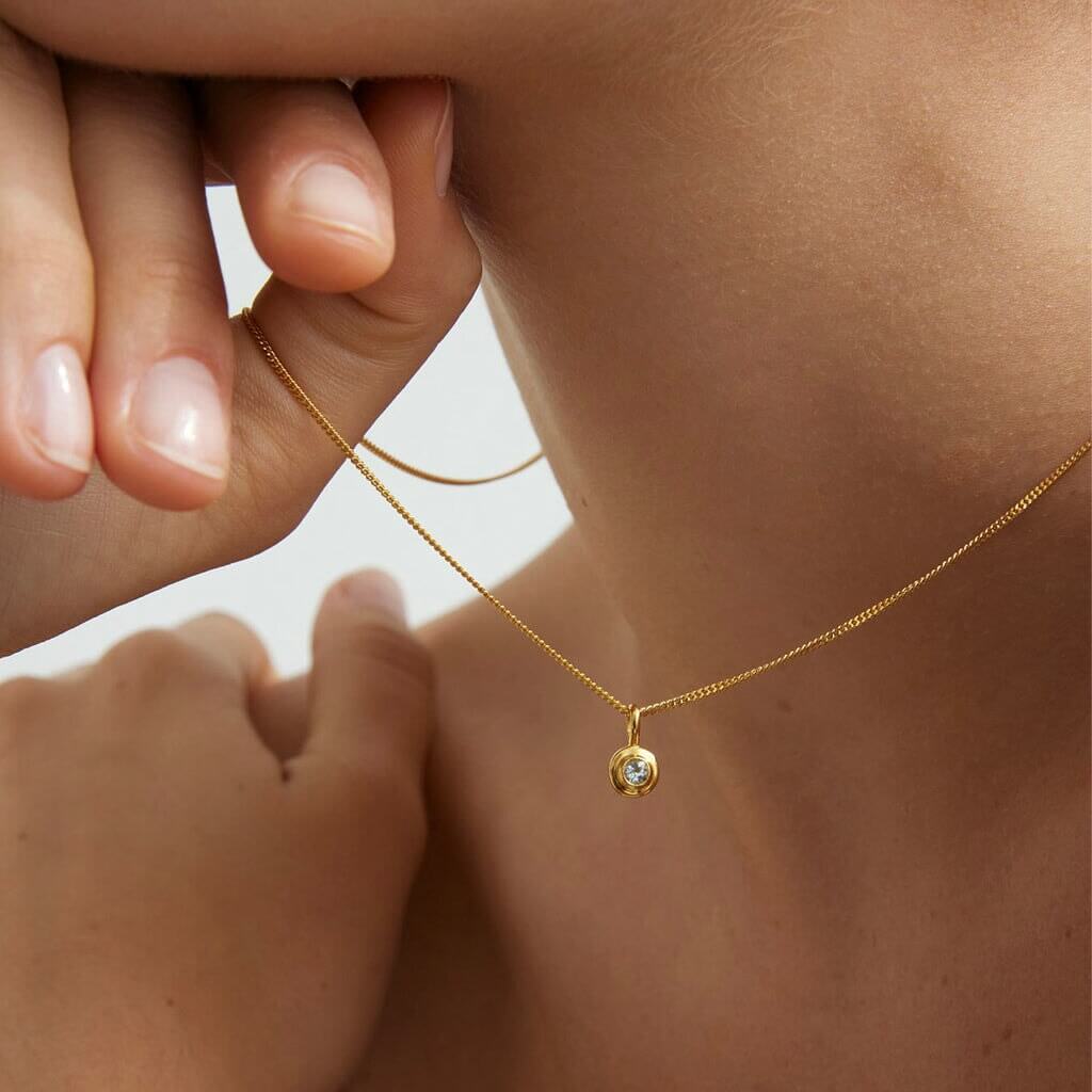 Alt Tag: Kirstin Ash Birthstone Collection Charm - March / Aquamarine gold vermeil aquamarine charm necklace close-up on neck