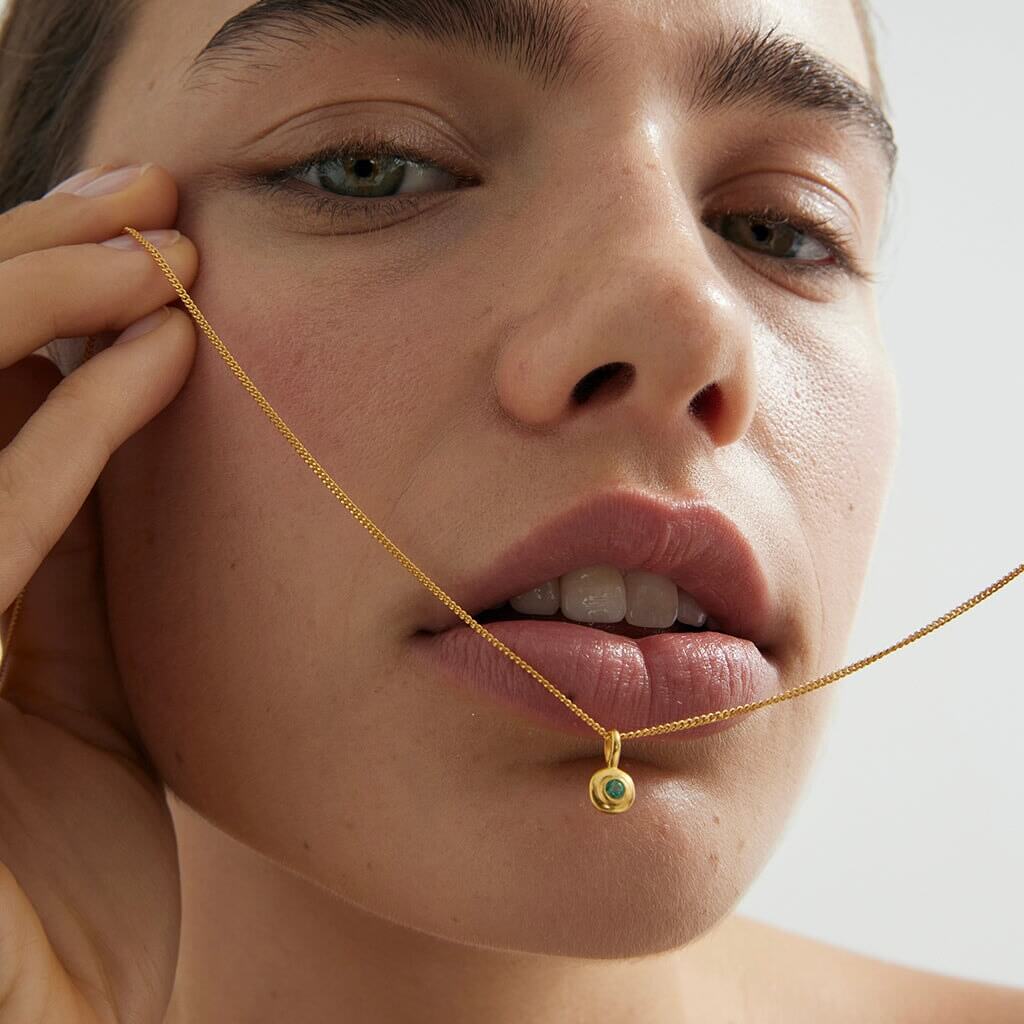 Alt Tag: Kirstin Ash Birthstone Collection Charm - May / Emerald gold vermeil necklace with emerald green charm close-up on model