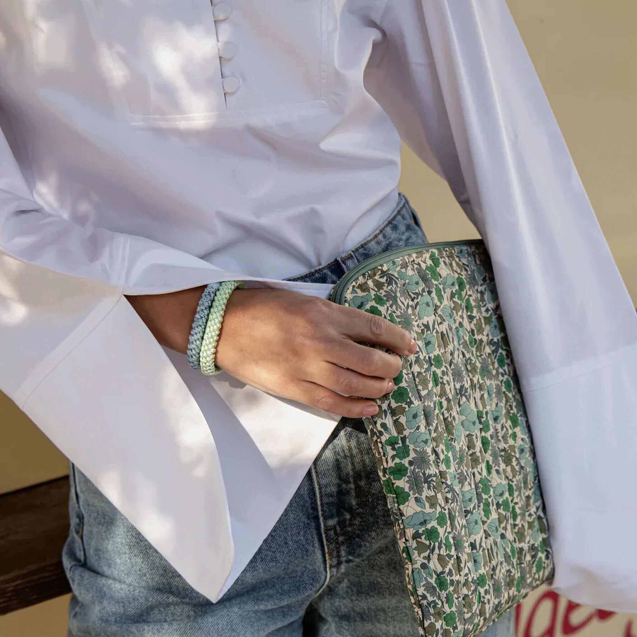 Alt Tag: Kknekki Hair Tie - Blue Silver Glitter worn on wrist, woven waterproof no-damage hair elastic with recycled bead