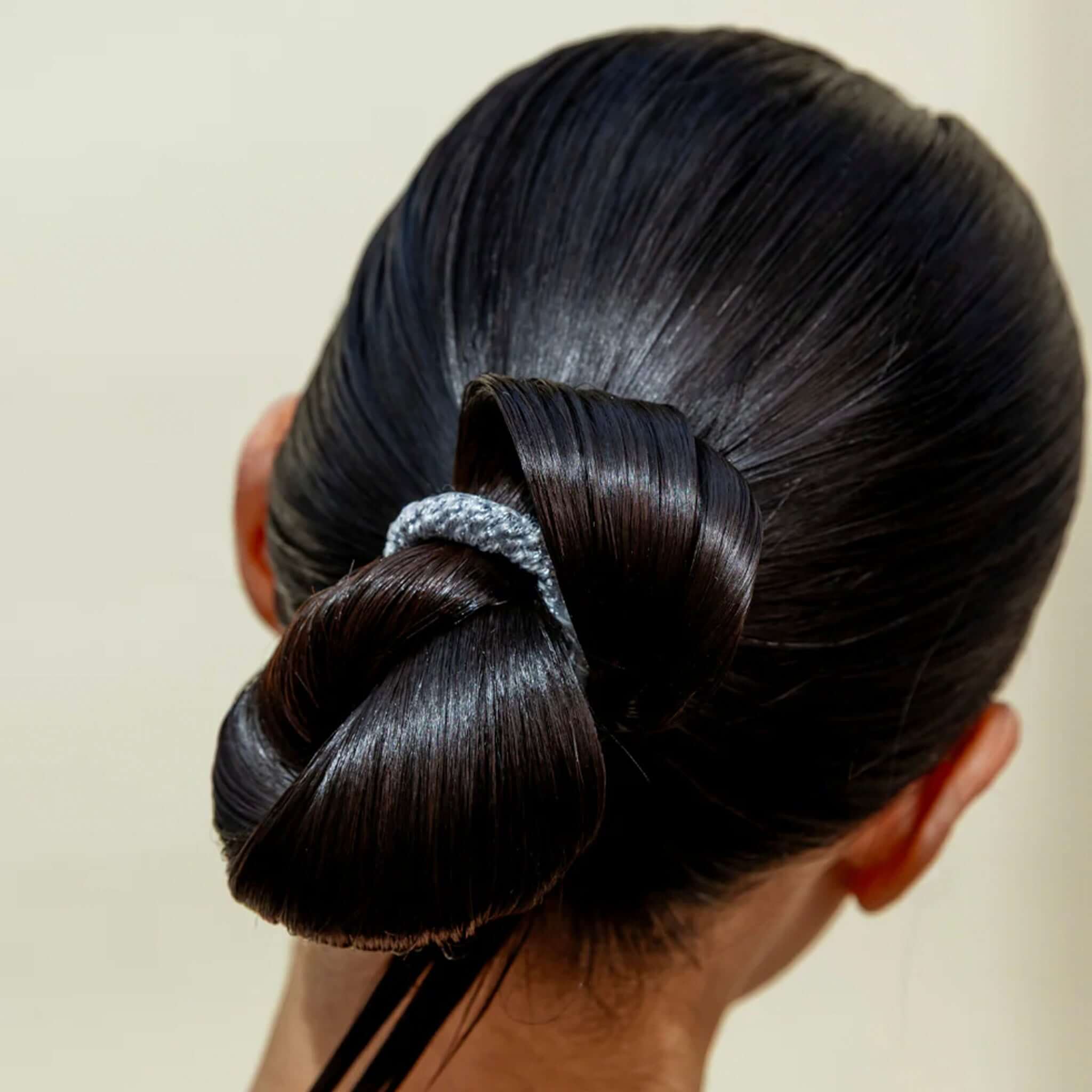 Alt Tag: Kknekki Hair Tie - Coral Glitter Stripe holding sleek bun, no-damage waterproof woven hair tie with recycled bead