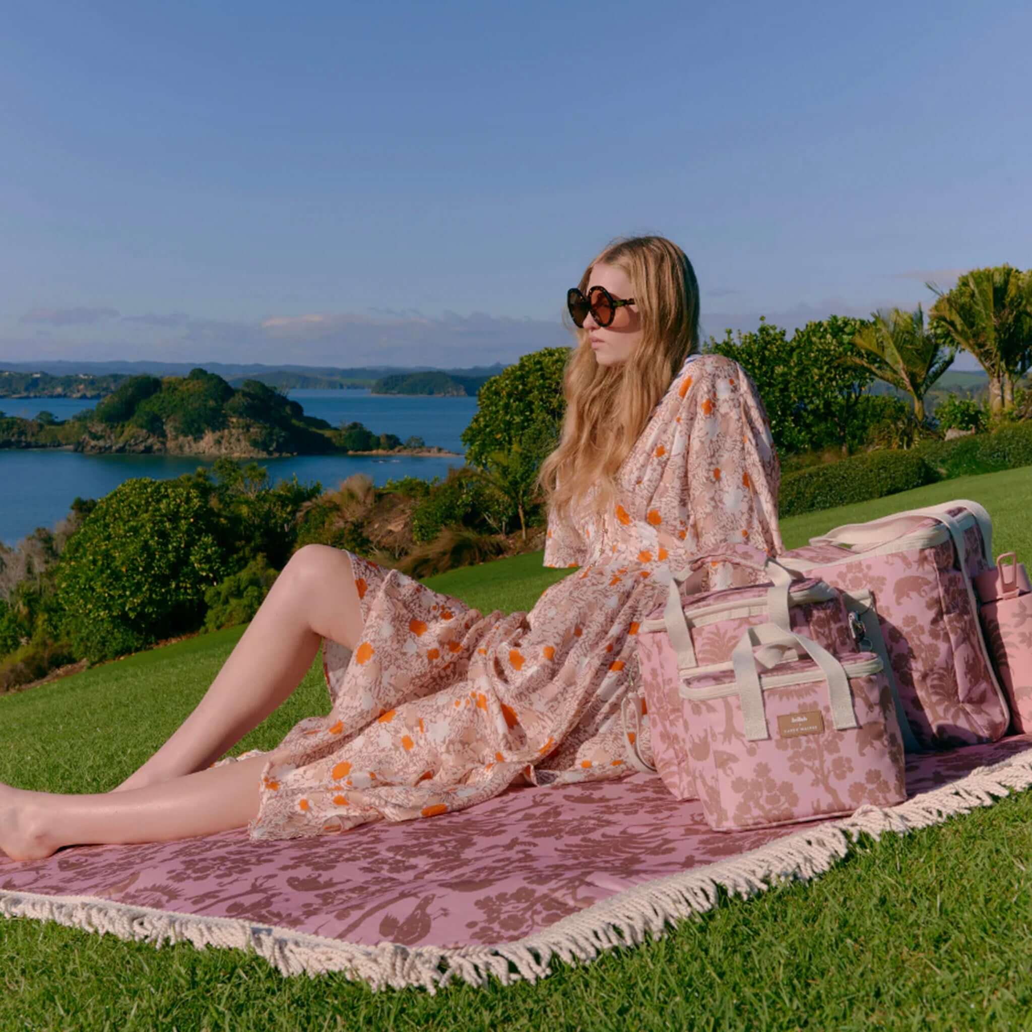 Kollab x Karen Walker Insulated Lunch Box - Animal Kingdom pink insulated lunch box on picnic blanket outdoors