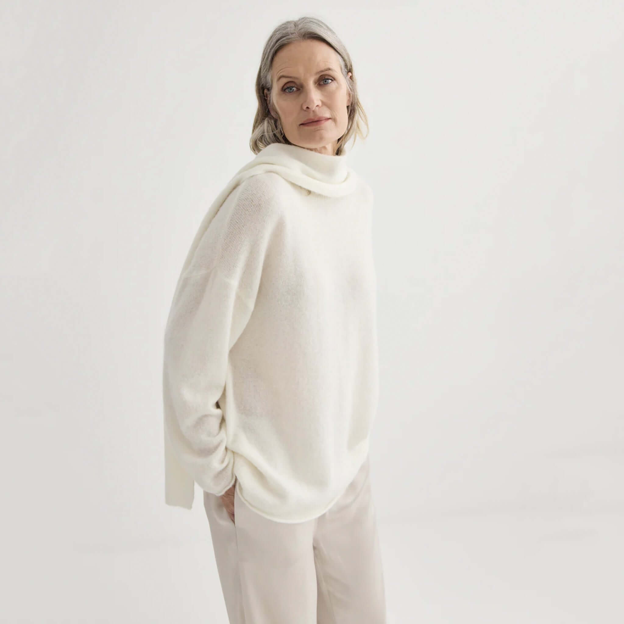 Alt Tag: Laing Alpaca Sweater with Tie - Ivory lightweight alpaca blend knit sweater on model, soft relaxed luxury drape
