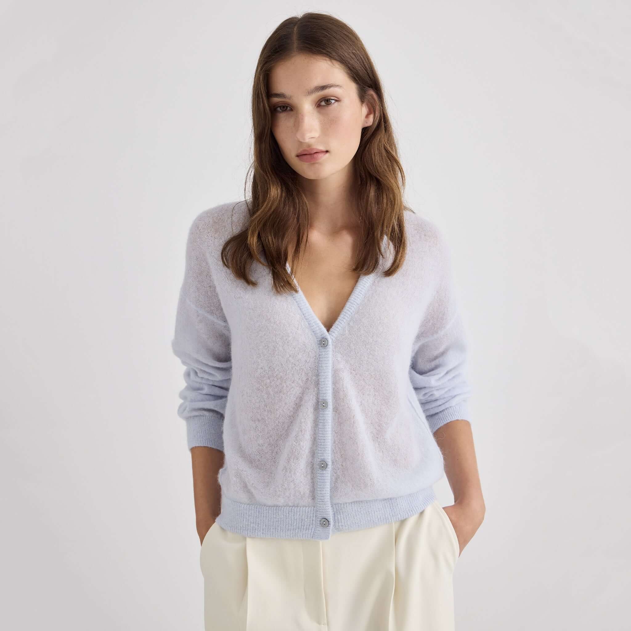 Laing Mila Alpaca & Merino Cardigan - Pale Blue worn by model with soft style in pale blue color.