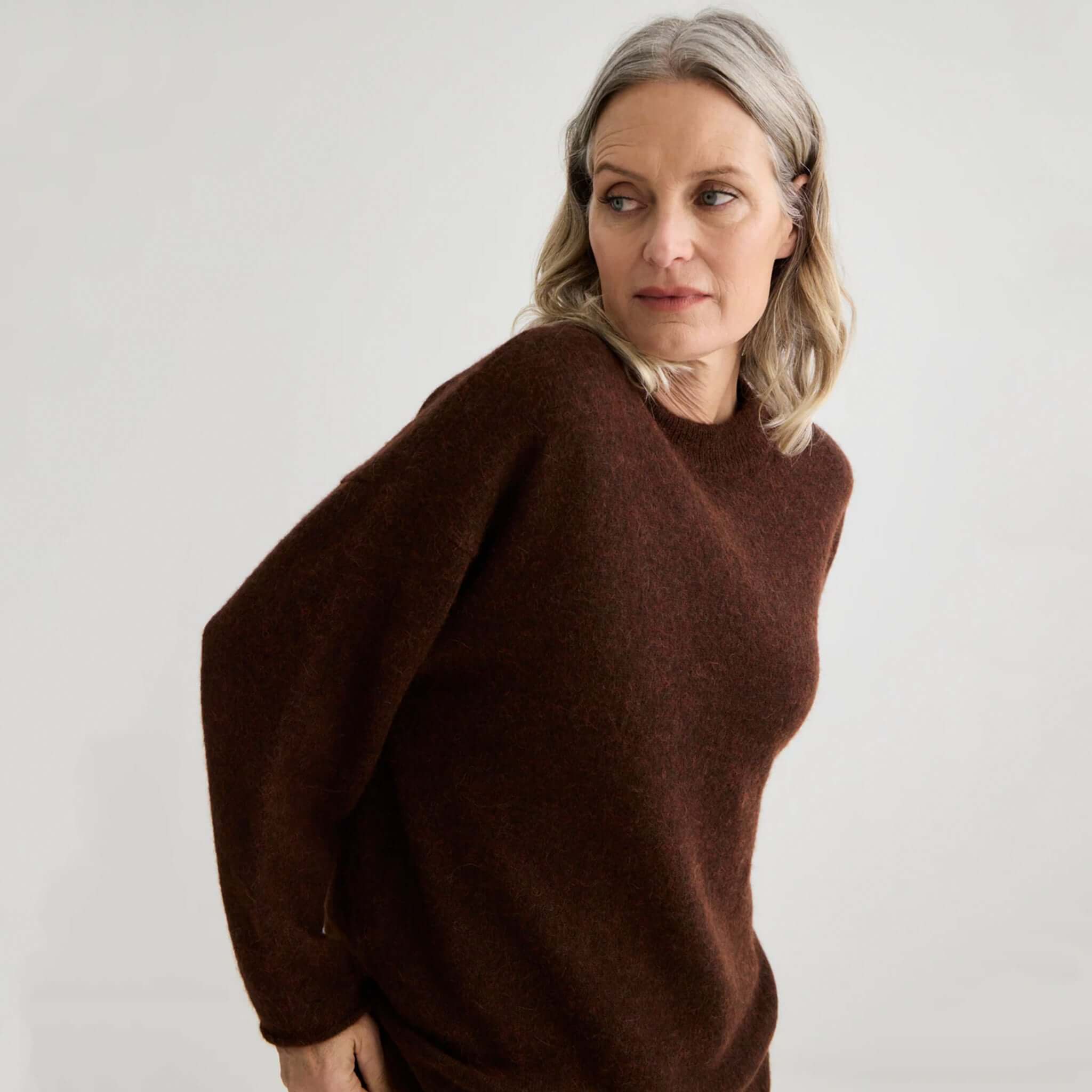 Alt Tag: Laing Alpaca Sweater with Tie - Mahogany Marle worn by model, soft alpaca-blend knit in rich mahogany tone