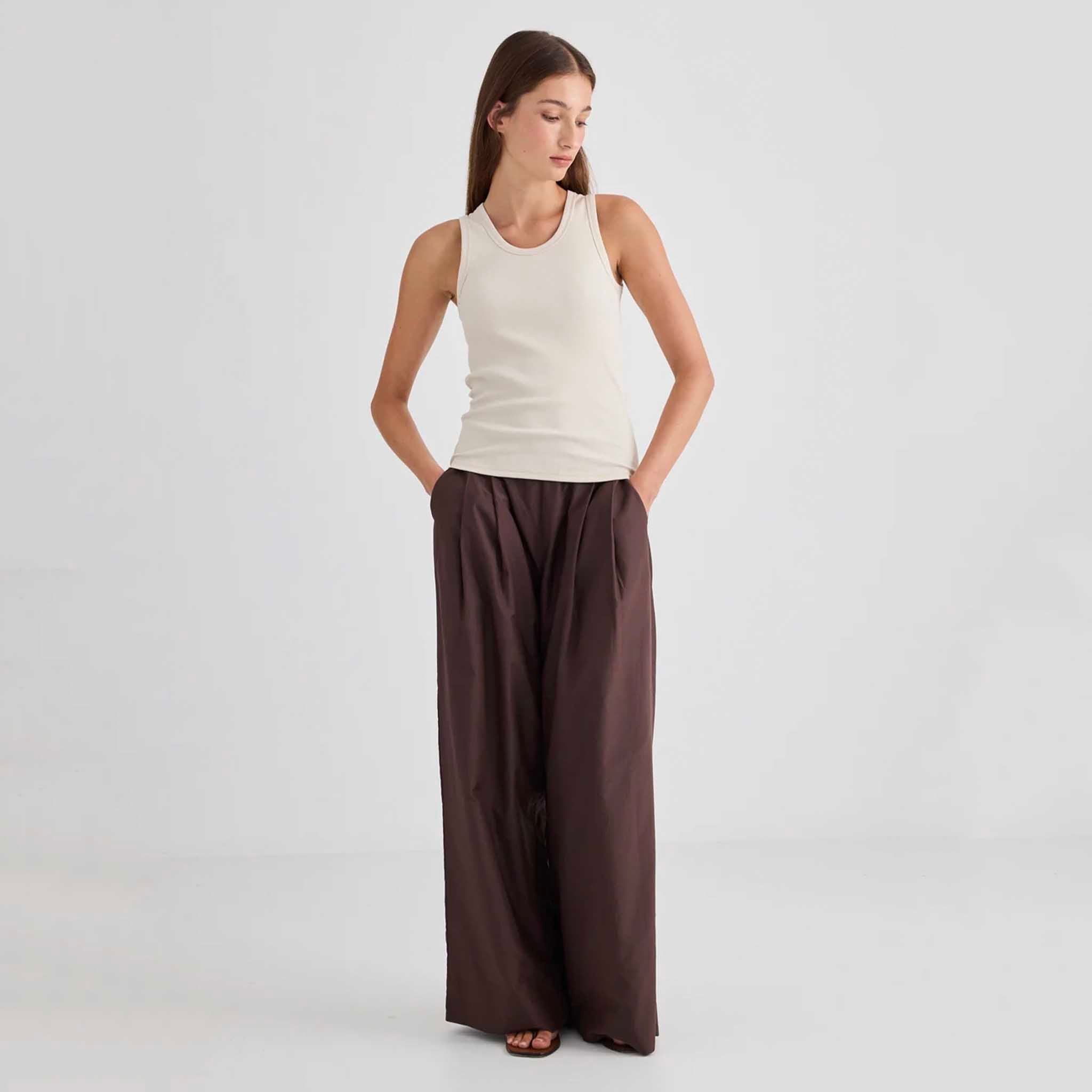 Laing Juna Ribbed Cotton Tank - Vanilla worn with wide-leg pants in a neutral setting.