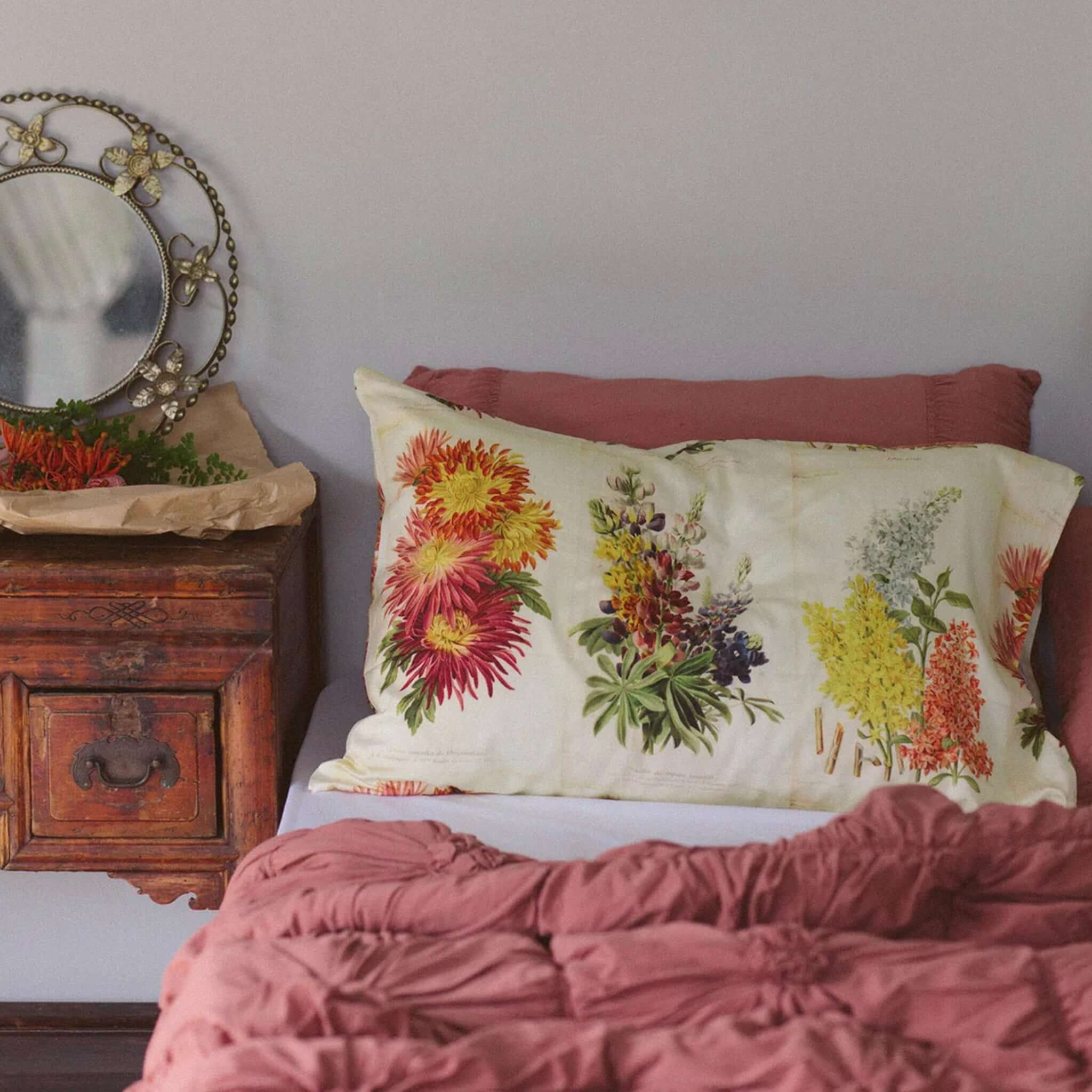 Alt Tag: Lazybones Organic Cotton Pillowslip Set - Horticole botanical flower illustration pillowcases on bed, creamy vintage yellow background