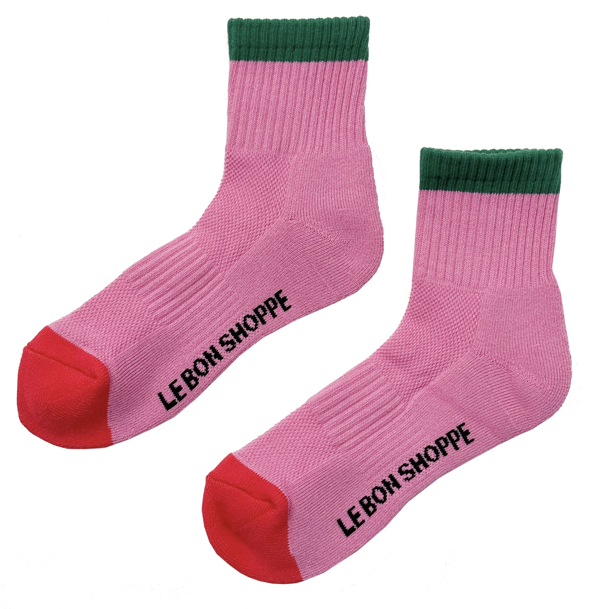 Pink socks with green cuffs and red toes, featuring 'Le Bon Shoppe' branding on a white background.