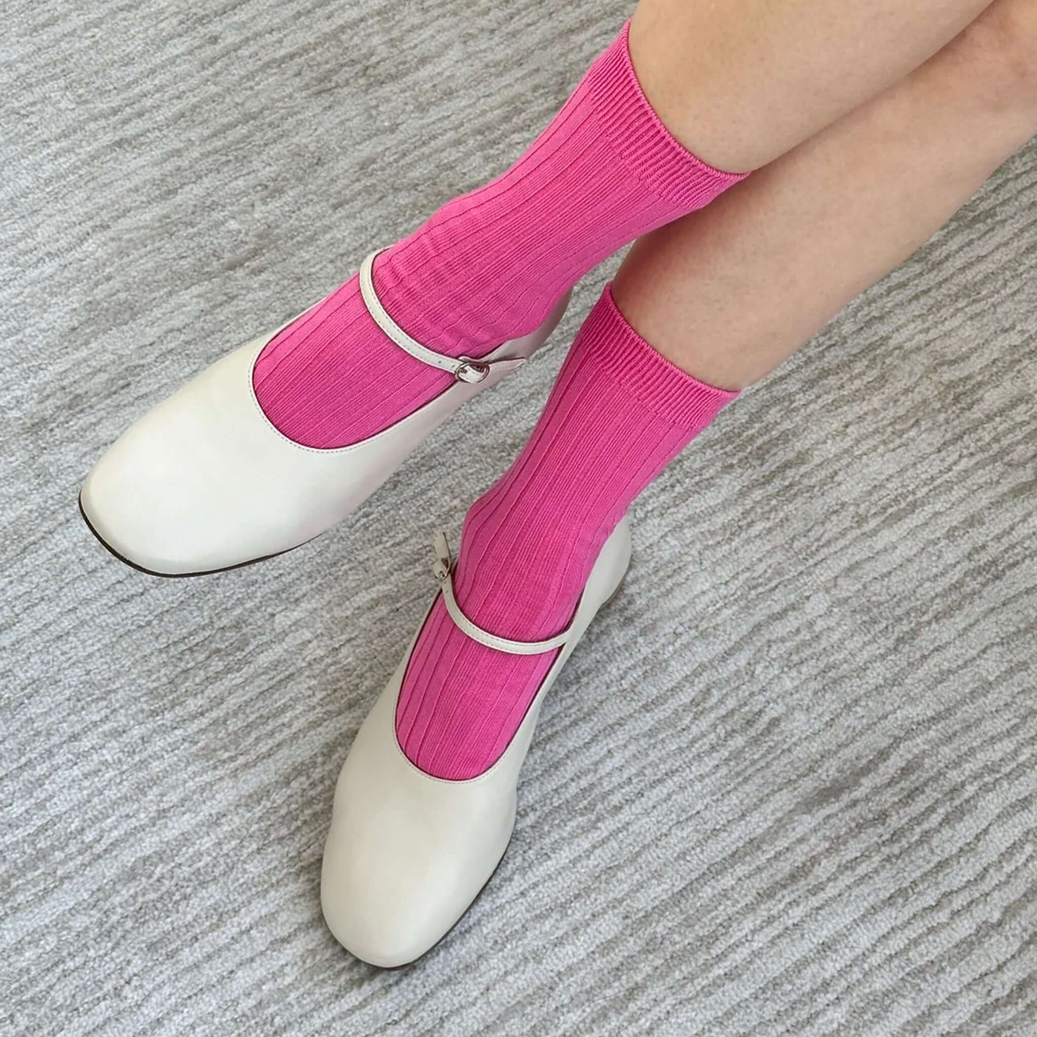 Alt Tag: Le Bon Shoppe Her Cotton Socks - Bright Pink ribbed cotton-blend crew socks styled with white Mary Jane flats