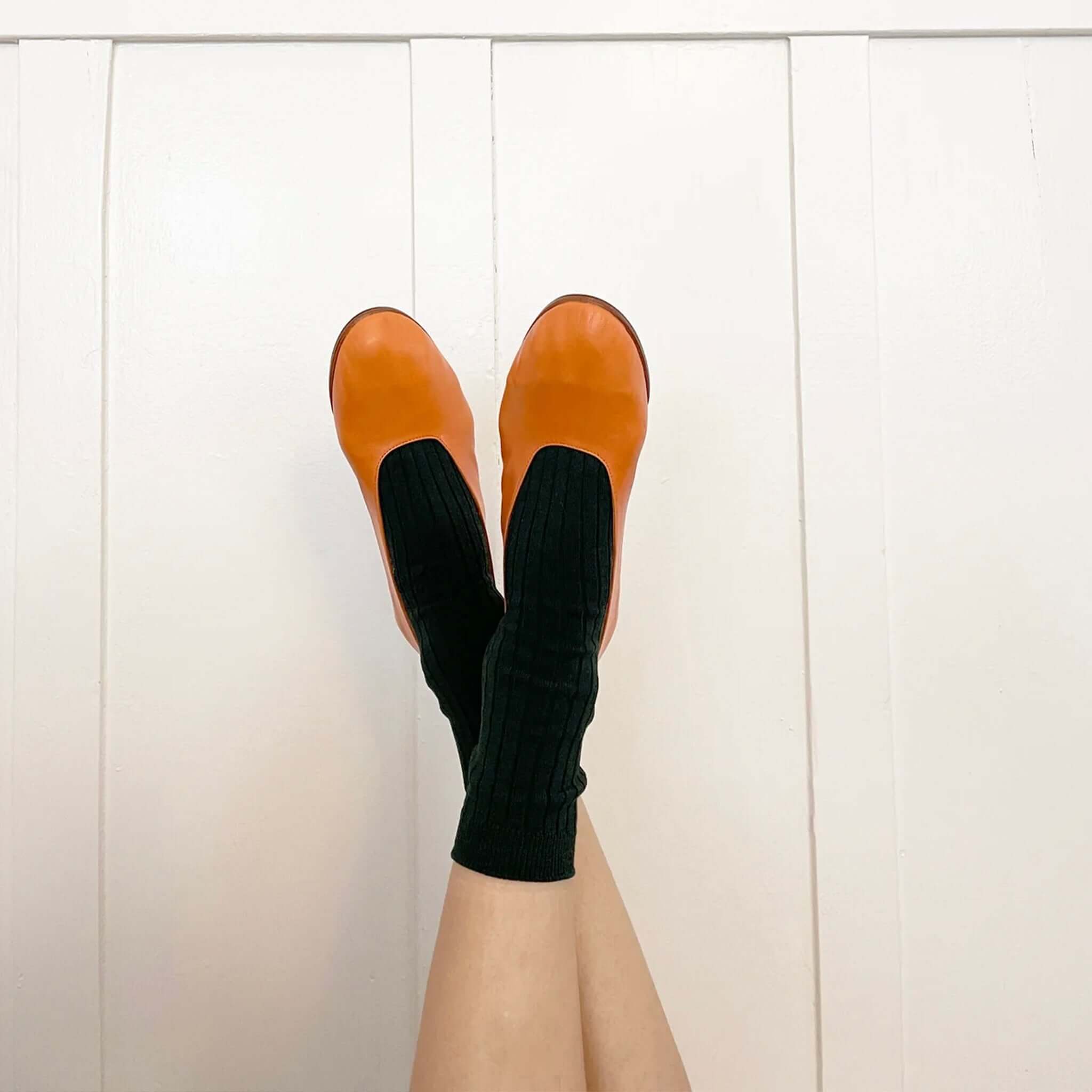 Alt Tag: Le Bon Shoppe Her Cotton Socks - Peacock ribbed cotton socks with clogs on crossed legs, lifestyle product photo