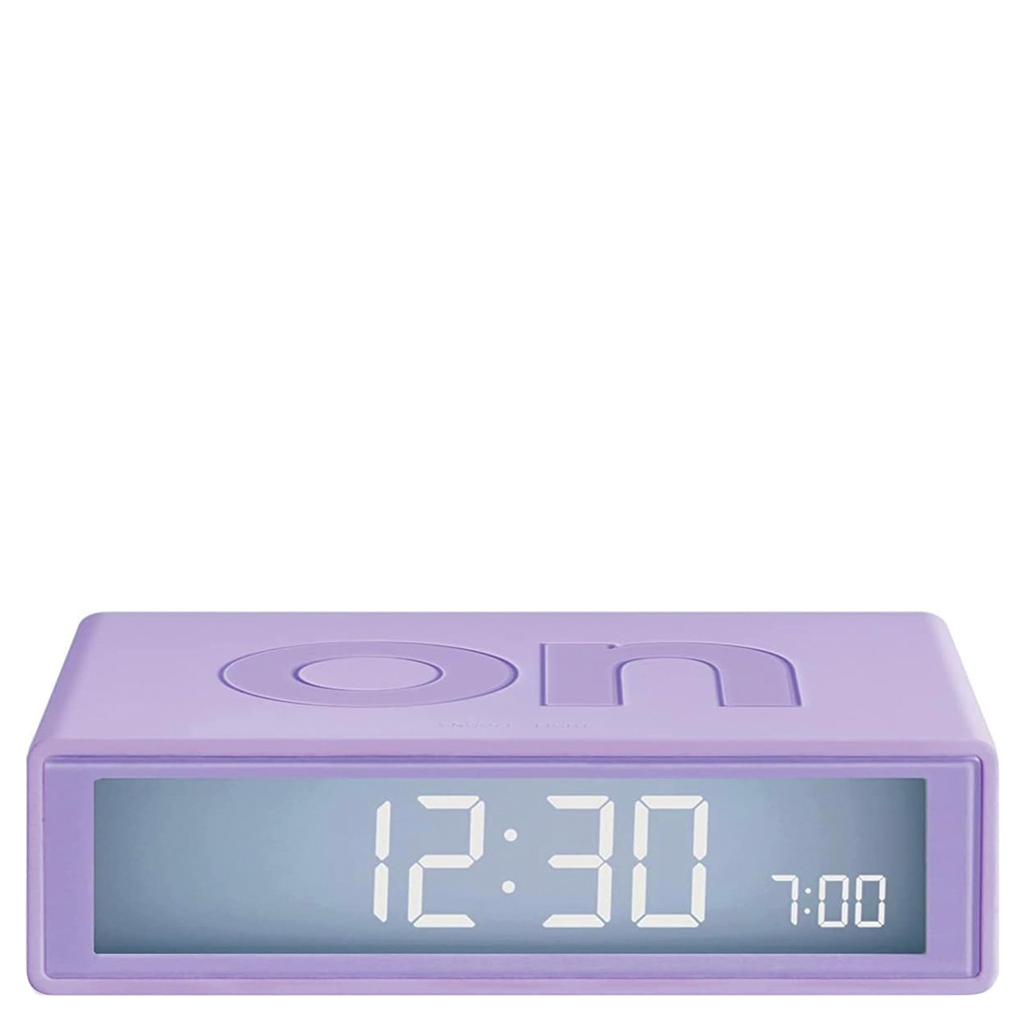 Purple digital clock with LED display on a white background