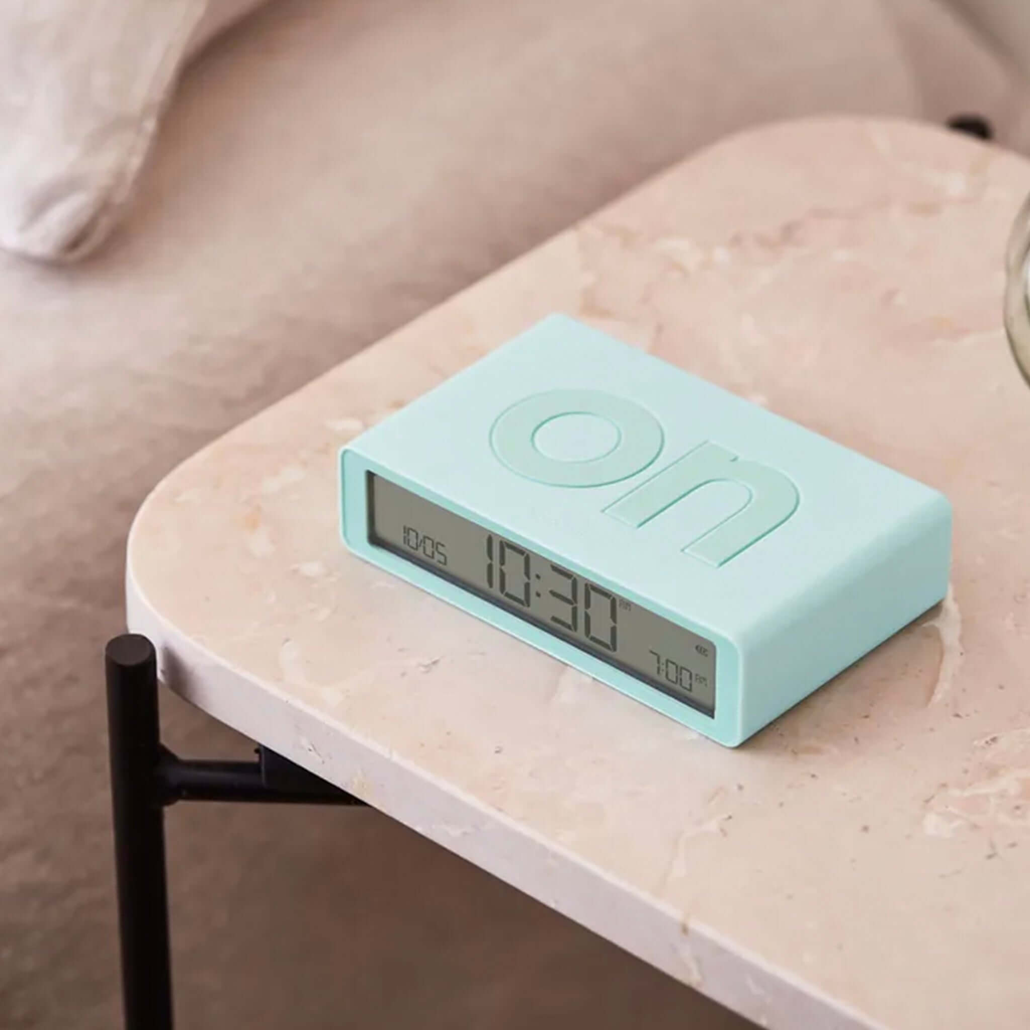 Mint Lexon Flip Classic Reversible LCD Alarm Clock on a table